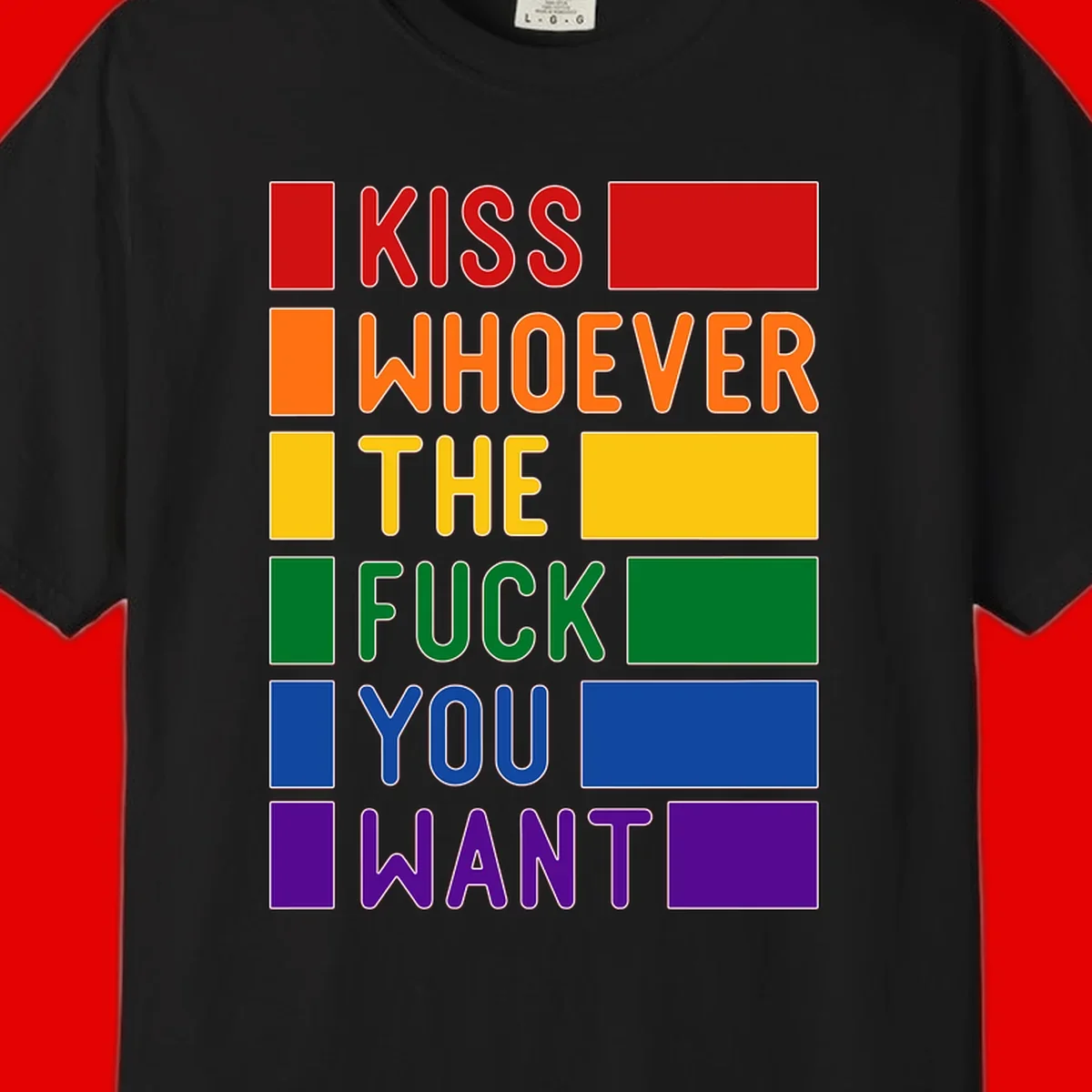 Colorful rainbow typography design reading 'Kiss Whoever The Fuck You Want' with each word in different pride colors on gray background