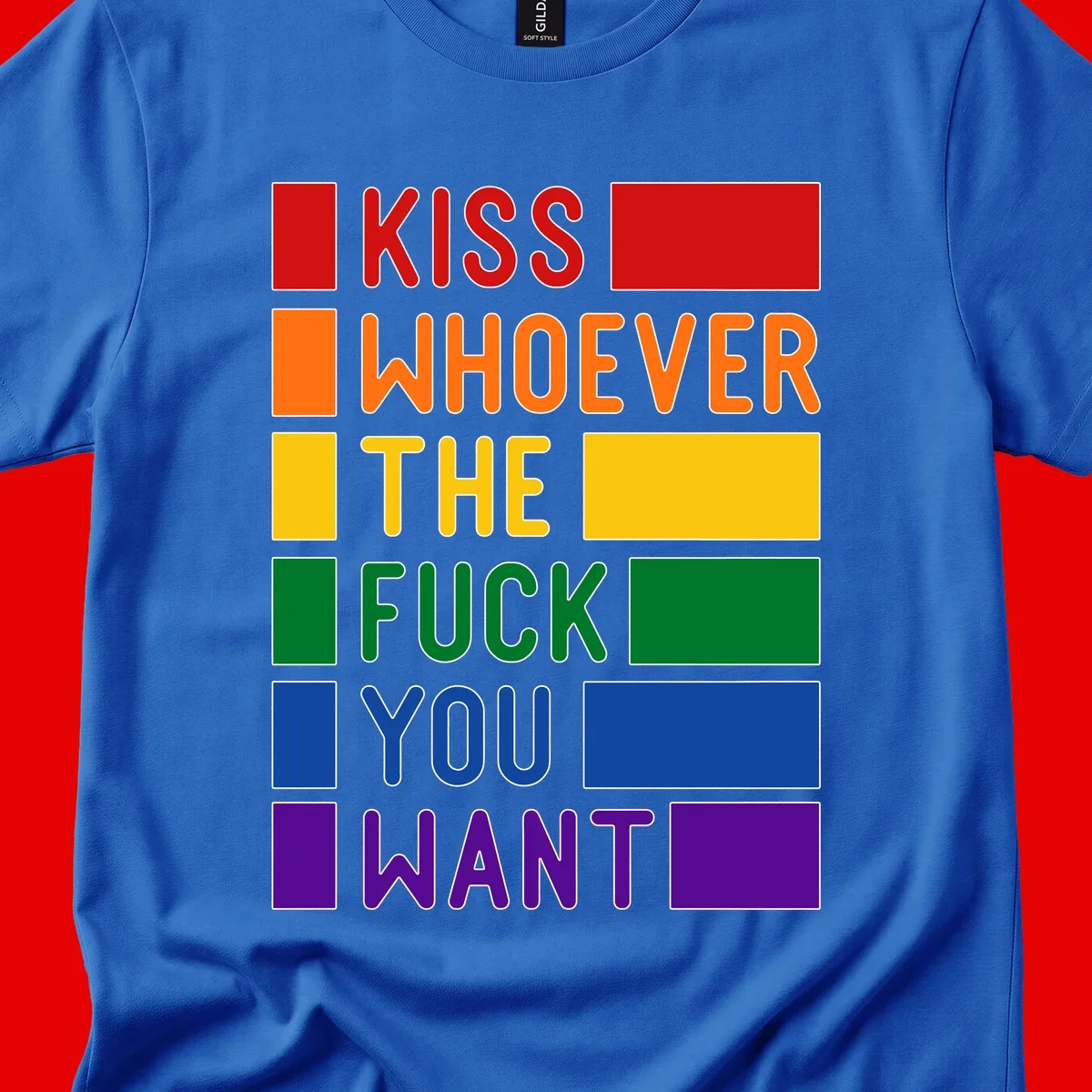 Colorful rainbow typography design reading 'Kiss Whoever The Fuck You Want' with each word in different pride colors on gray background
