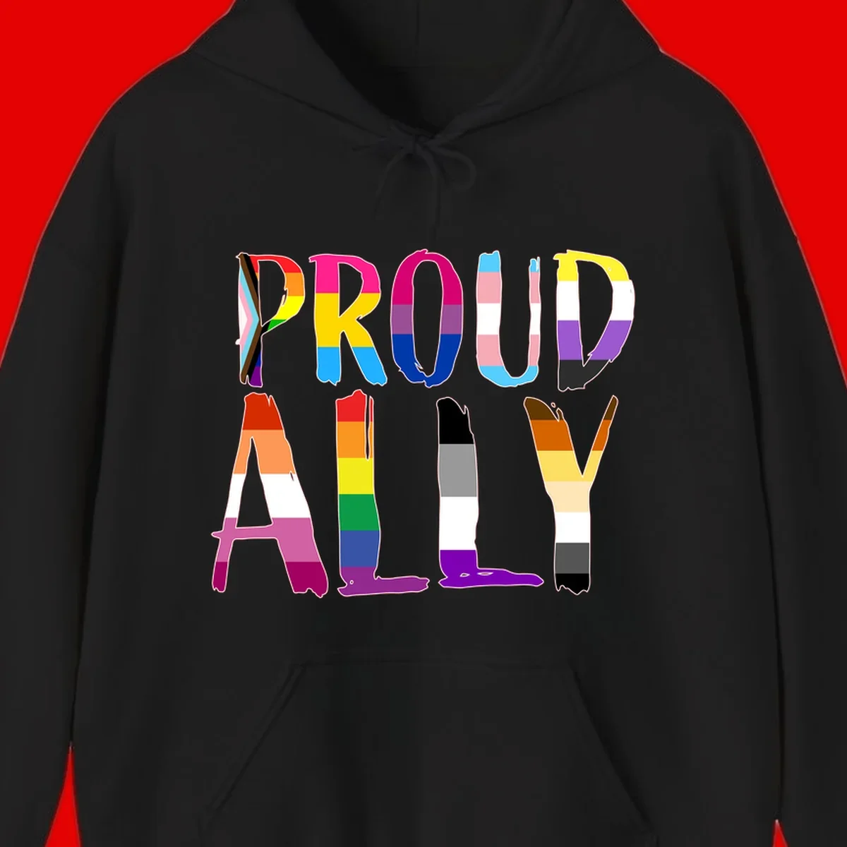 Colorful block letters spelling PROUD filled with rainbow pride flag stripes and patterns including trans and progress pride designs