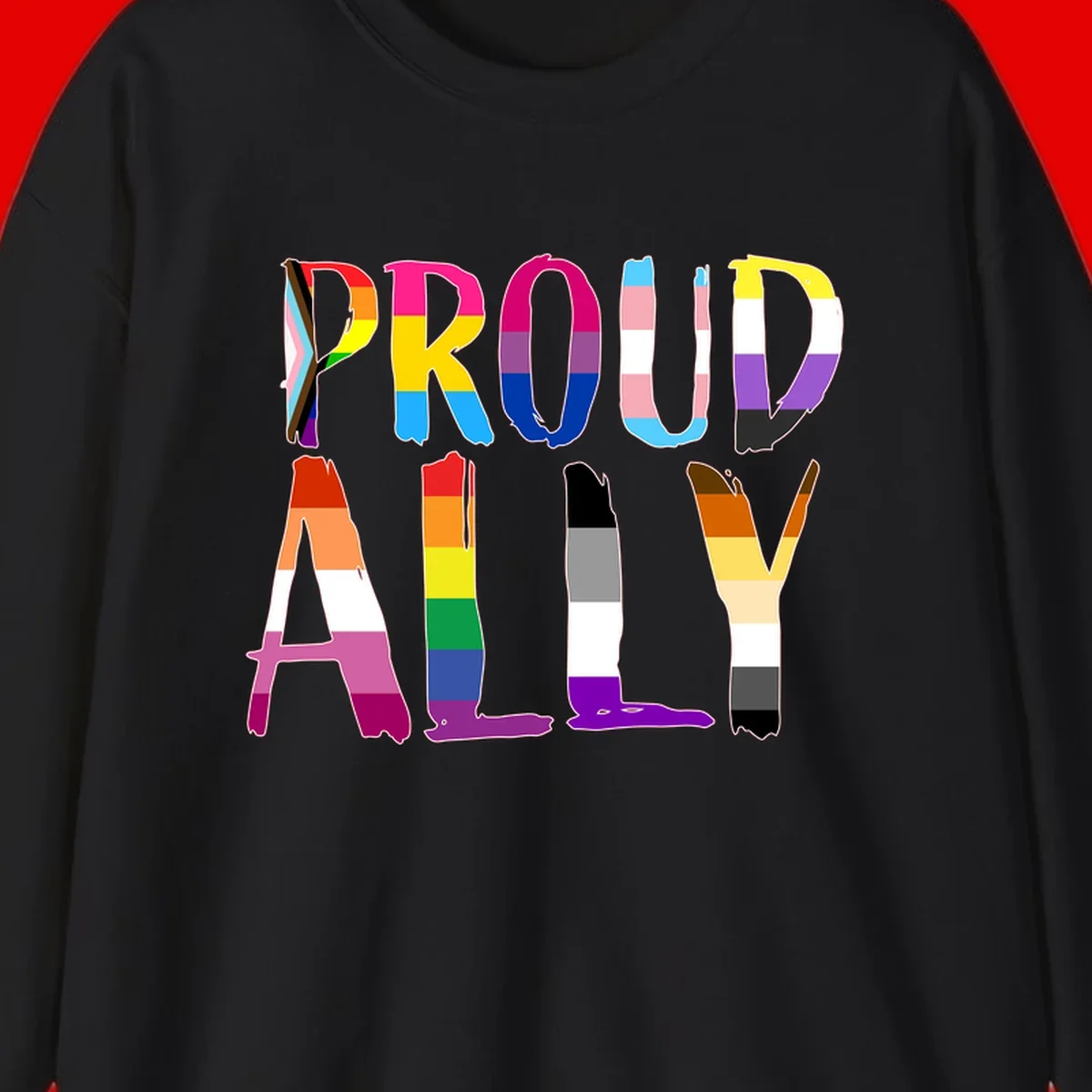 Colorful block letters spelling PROUD filled with rainbow pride flag stripes and patterns including trans and progress pride designs