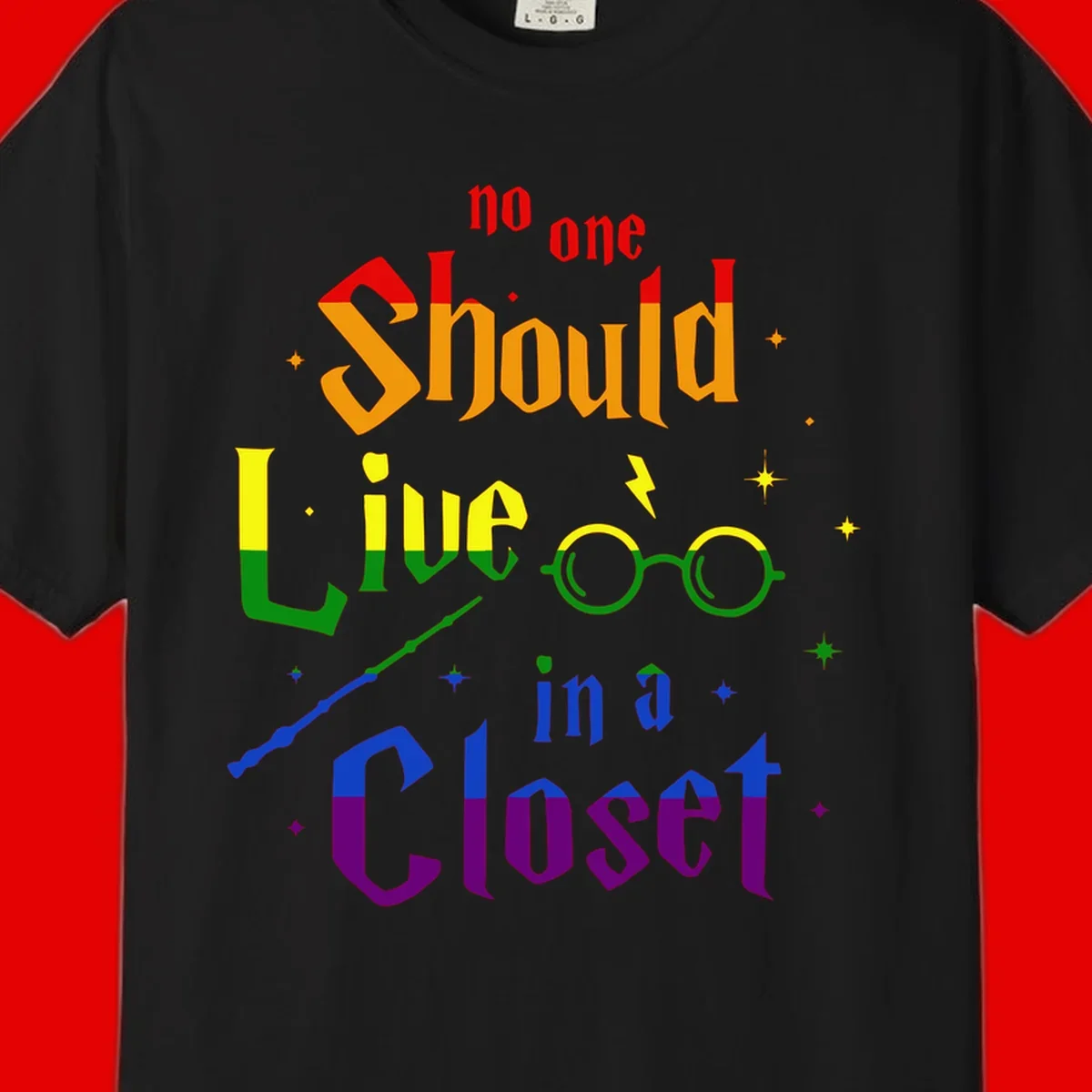 Rainbow gradient text reading 'no one Should live in a Closet' with magical elements including glasses, wand, and stars on gray background