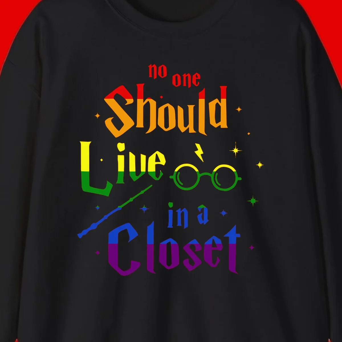 Rainbow gradient text reading 'no one Should live in a Closet' with magical elements including glasses, wand, and stars on gray background