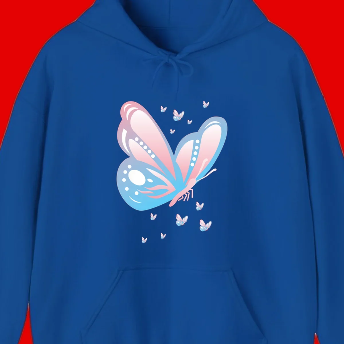 Large butterfly with pink and blue gradient wings featuring white dot details, surrounded by smaller flying butterflies on gray background