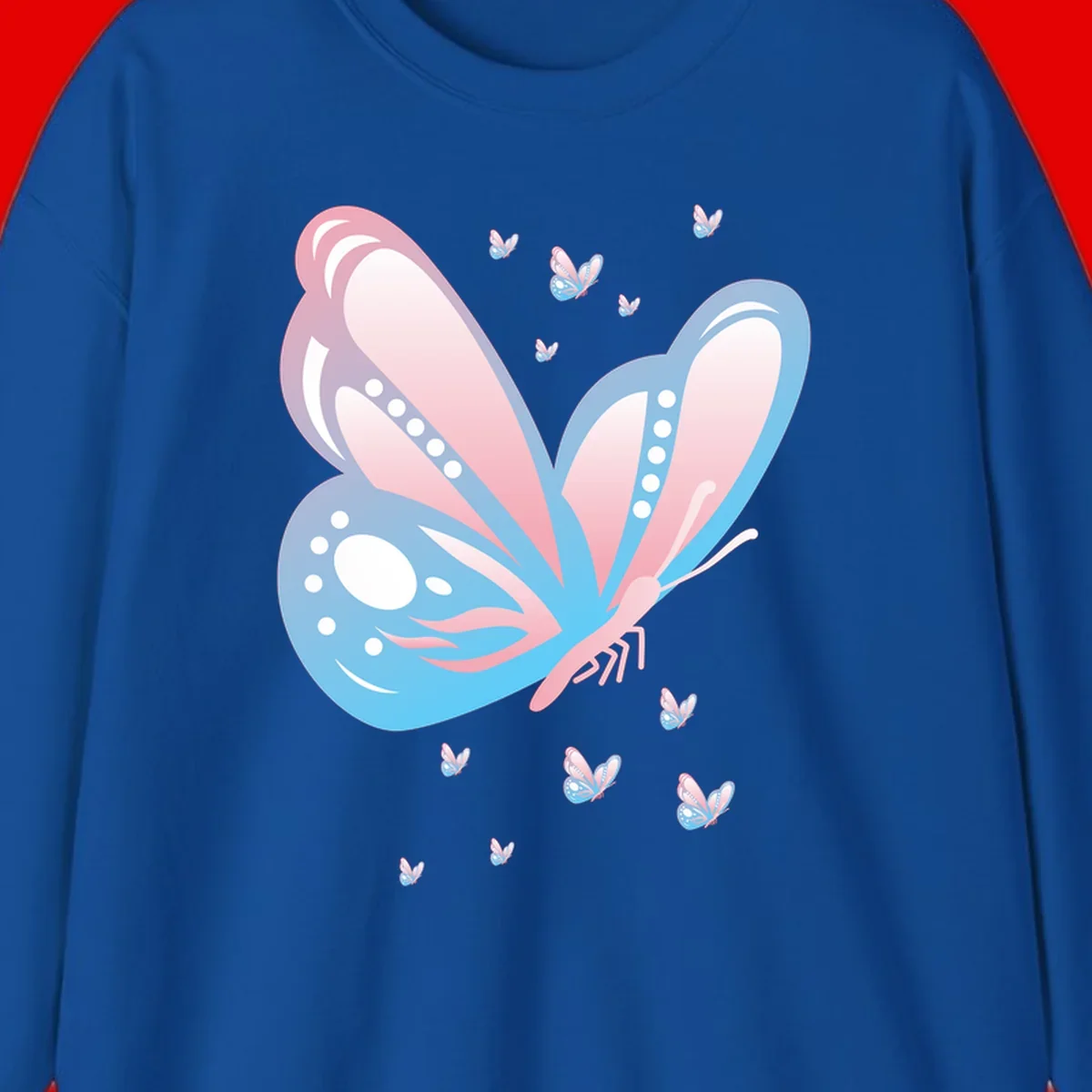 Large butterfly with pink and blue gradient wings featuring white dot details, surrounded by smaller flying butterflies on gray background
