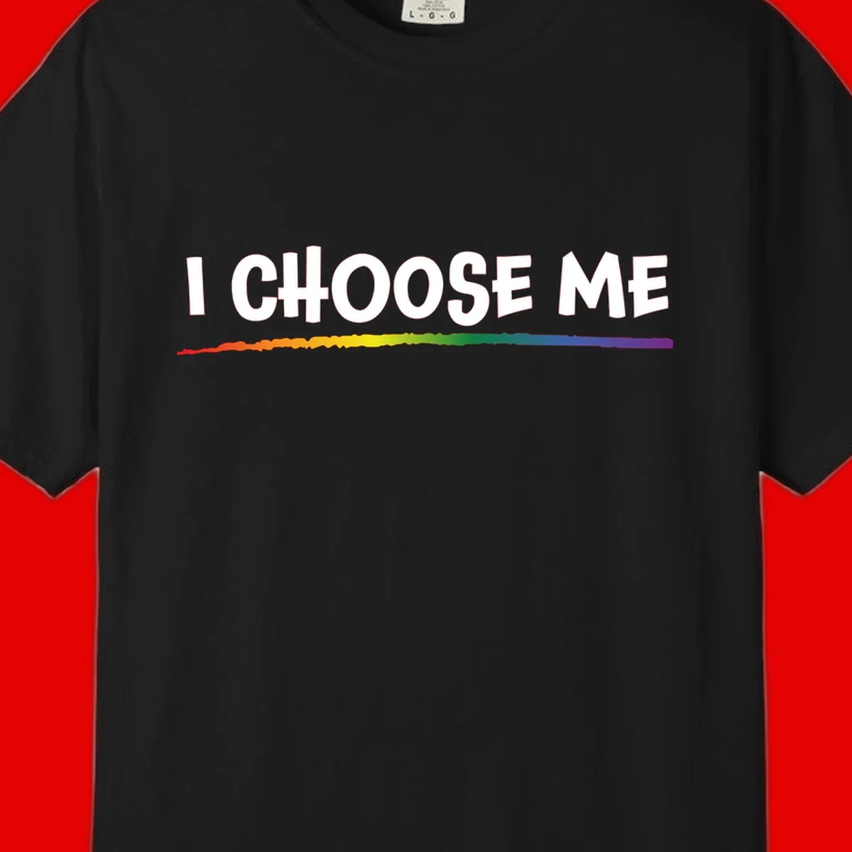 White text 'I Choose Me' above a vibrant rainbow gradient bar with pride flag colors on gray background