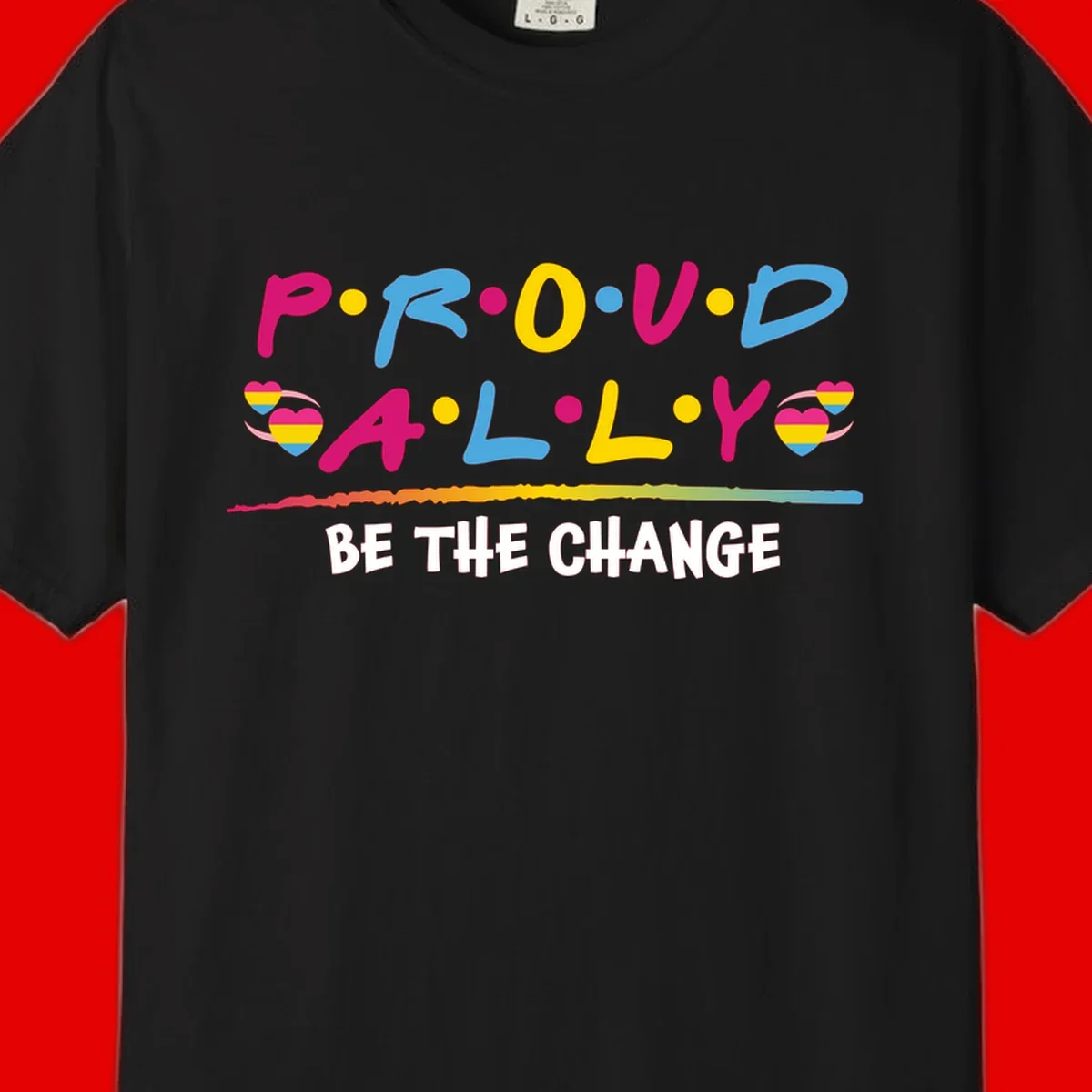 Colorful proud ally pride design with rainbow hearts, bold lettering spelling P.R.O.U.D and A.L.L.Y, and 'BE THE CHANGE' message