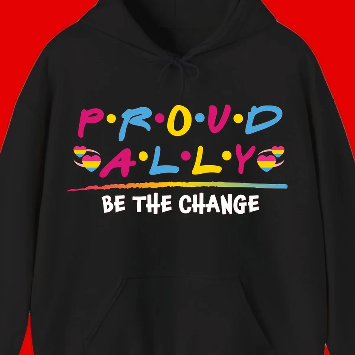 Colorful proud ally pride design with rainbow hearts, bold lettering spelling P.R.O.U.D and A.L.L.Y, and 'BE THE CHANGE' message