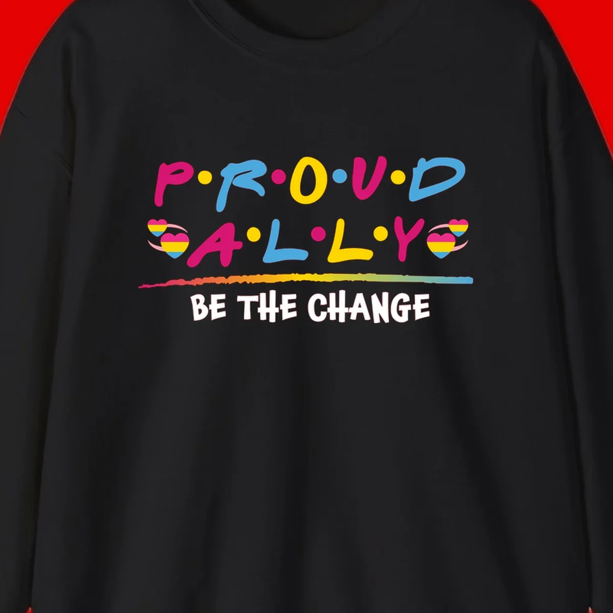 Colorful proud ally pride design with rainbow hearts, bold lettering spelling P.R.O.U.D and A.L.L.Y, and 'BE THE CHANGE' message