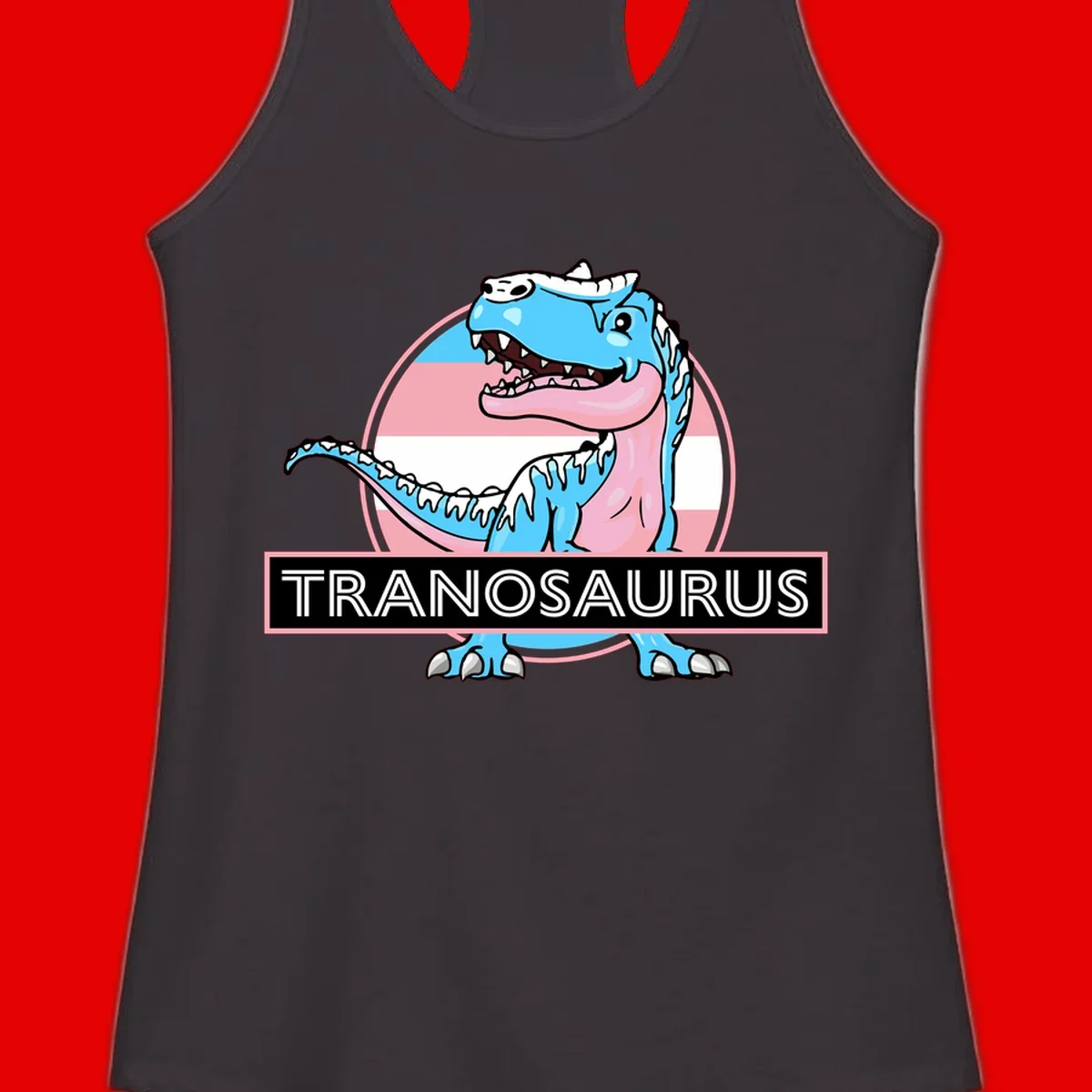 Blue cartoon T-Rex dinosaur with open mouth against pink and white pride flag circular background, labeled Tranosaurus