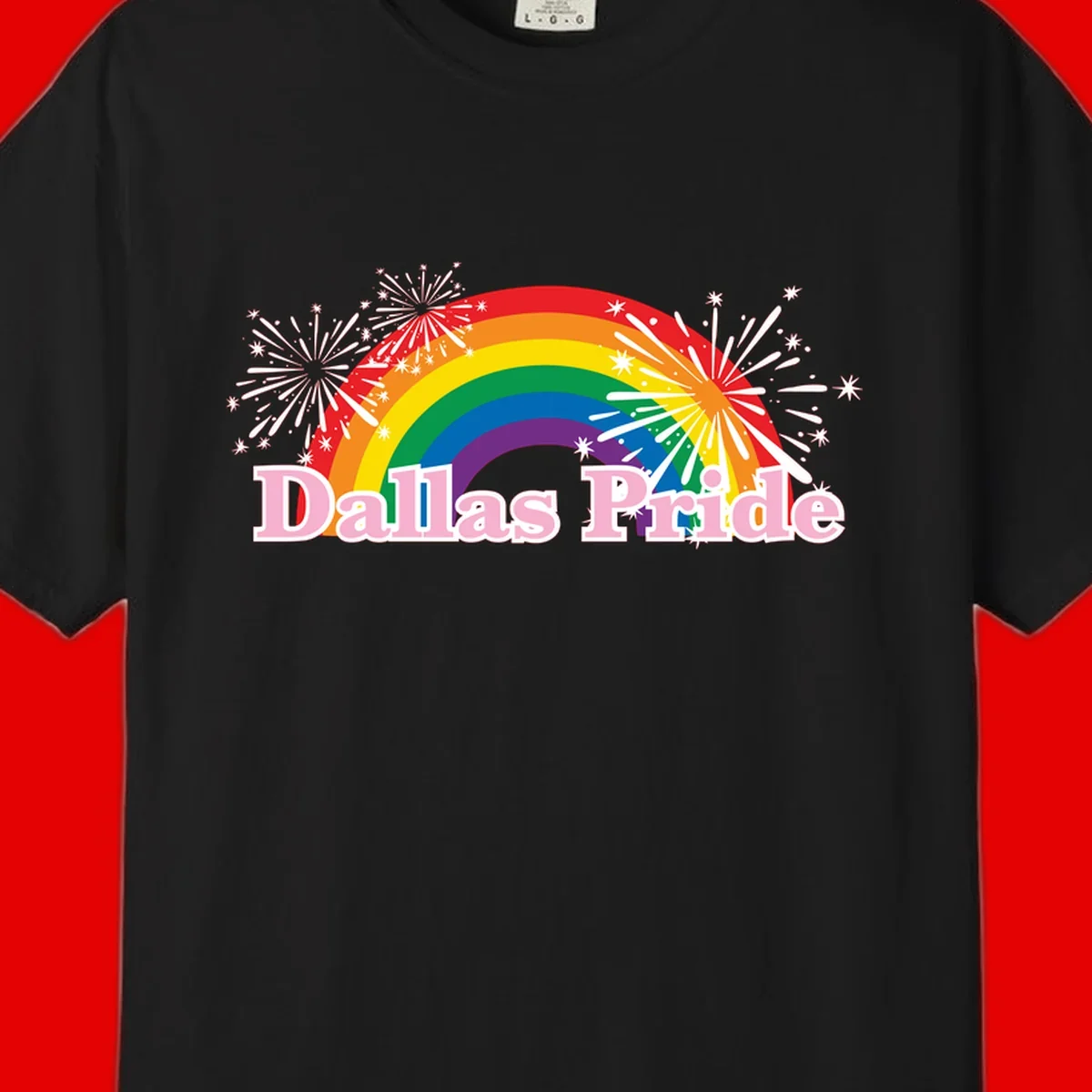 Dallas Pride design with rainbow arc, white fireworks bursts, and pink text on gray background