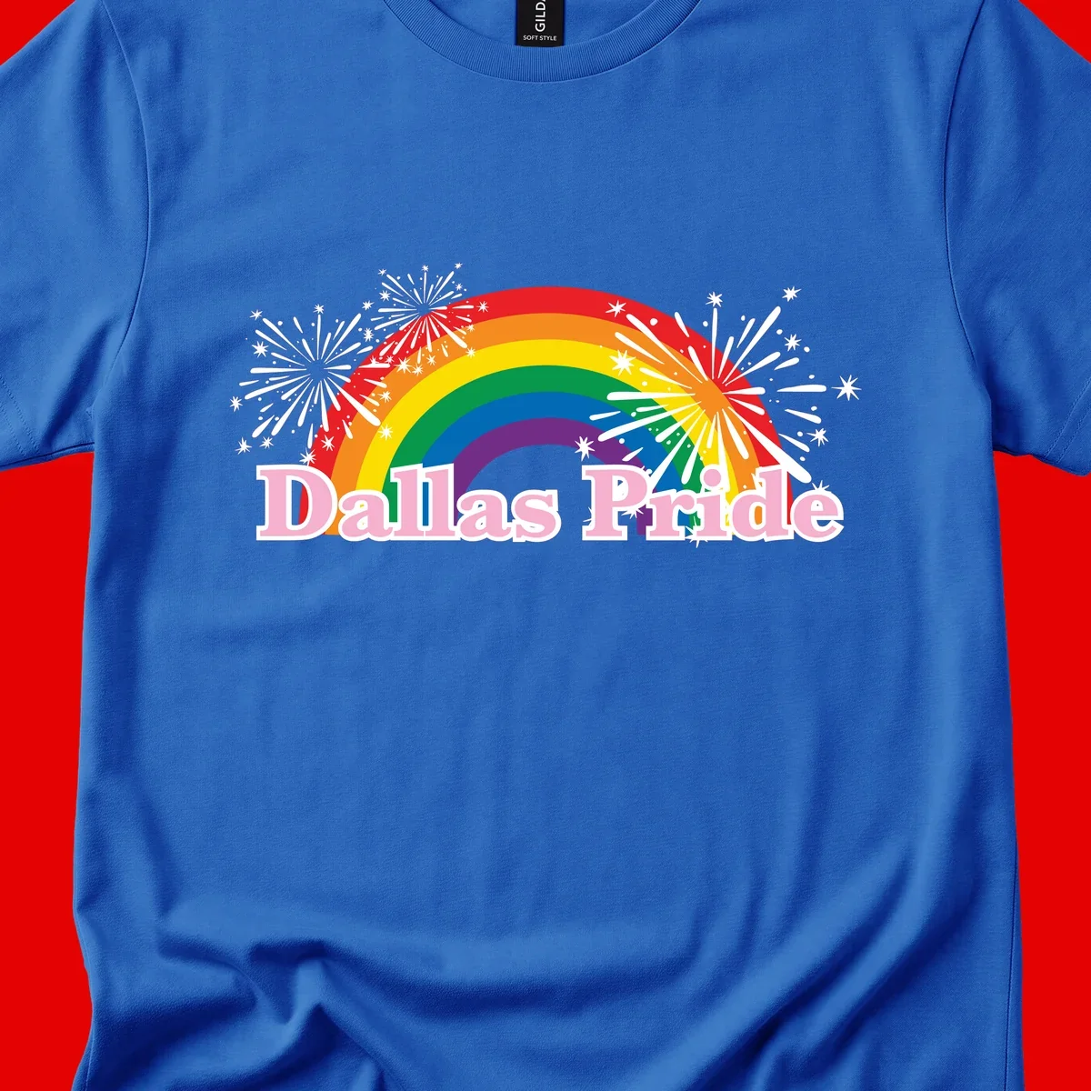 Dallas Pride design with rainbow arc, white fireworks bursts, and pink text on gray background