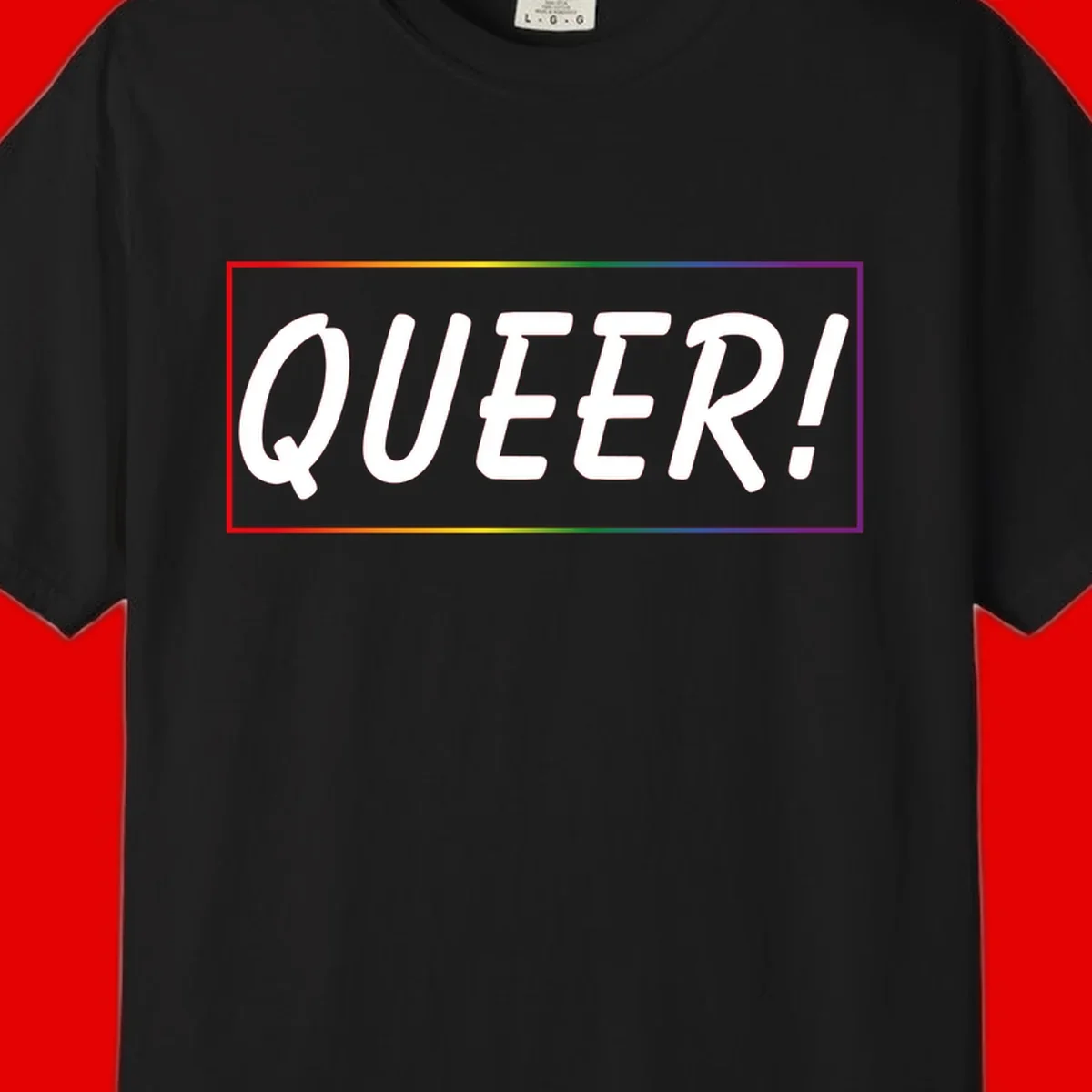White bold text reading 'QUEER!' on gray background with rainbow gradient border representing pride colors