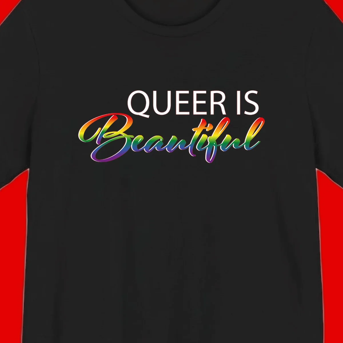 Rainbow gradient text reading 'Queer Is Beautiful' in pride flag colors on gray background