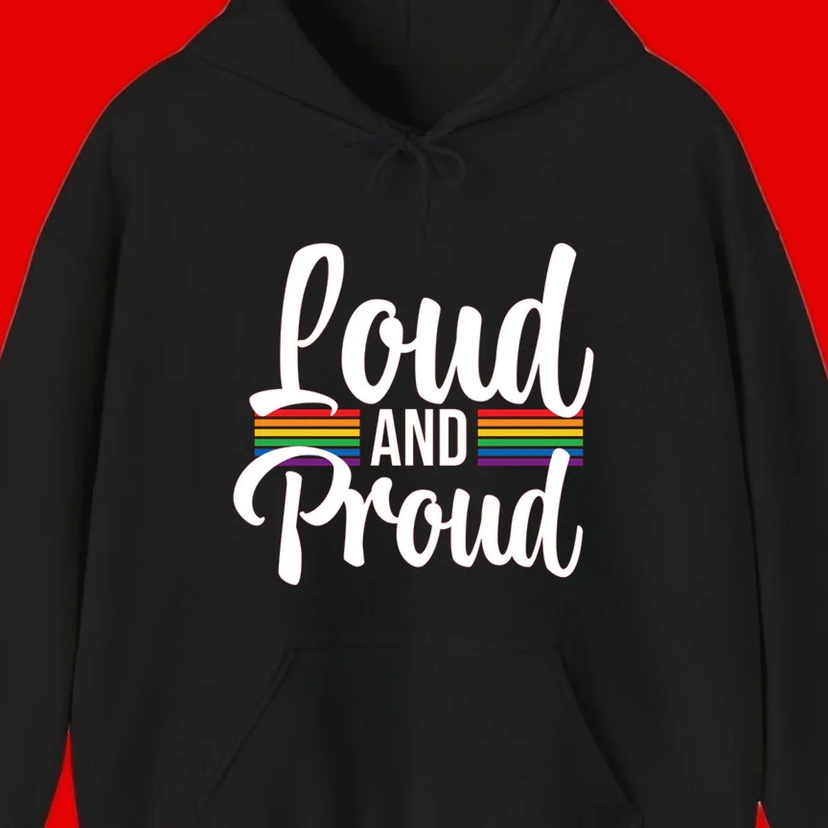 Loud and Proud rainbow pride design with white flowing text and horizontal rainbow stripes on gray background