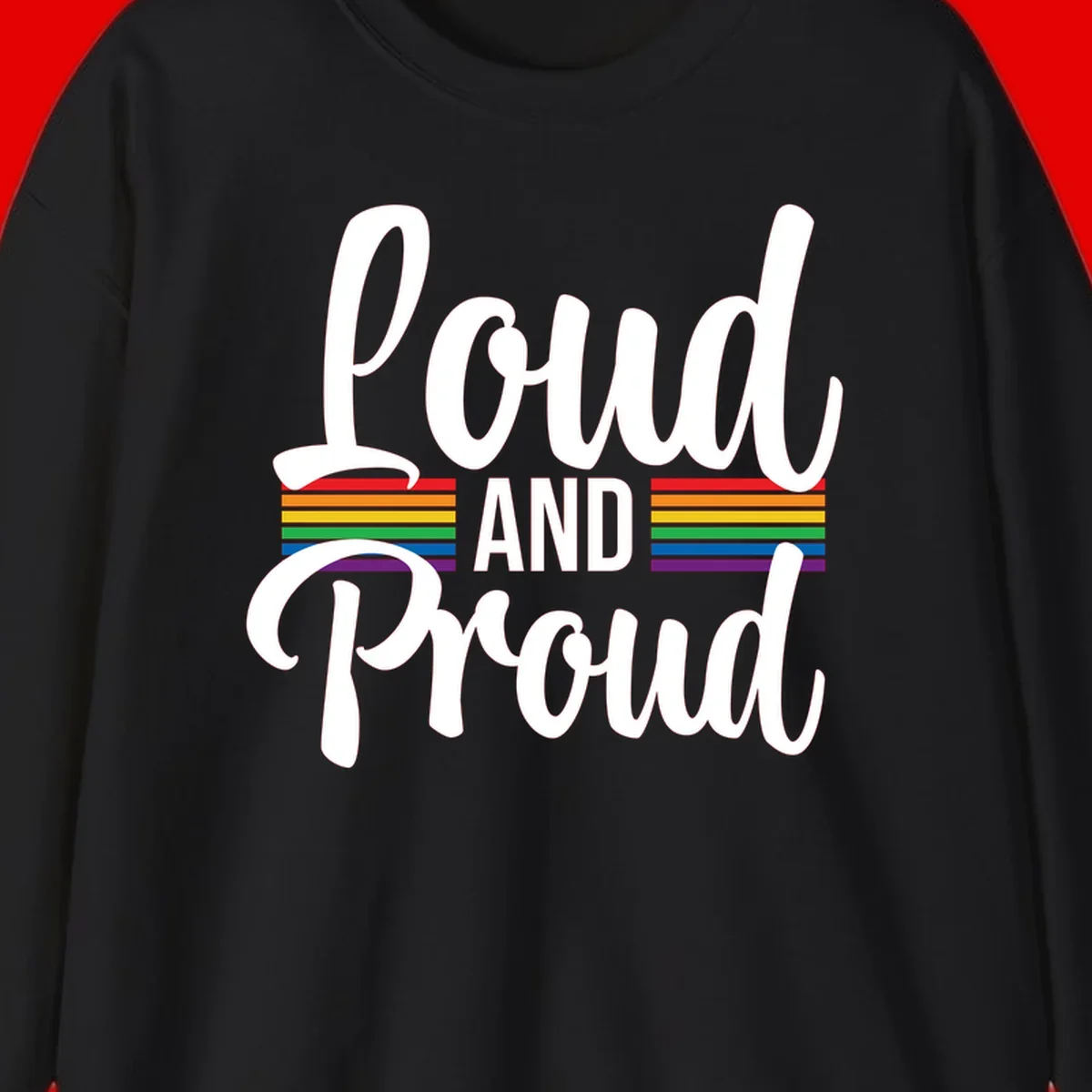 Loud and Proud rainbow pride design with white flowing text and horizontal rainbow stripes on gray background