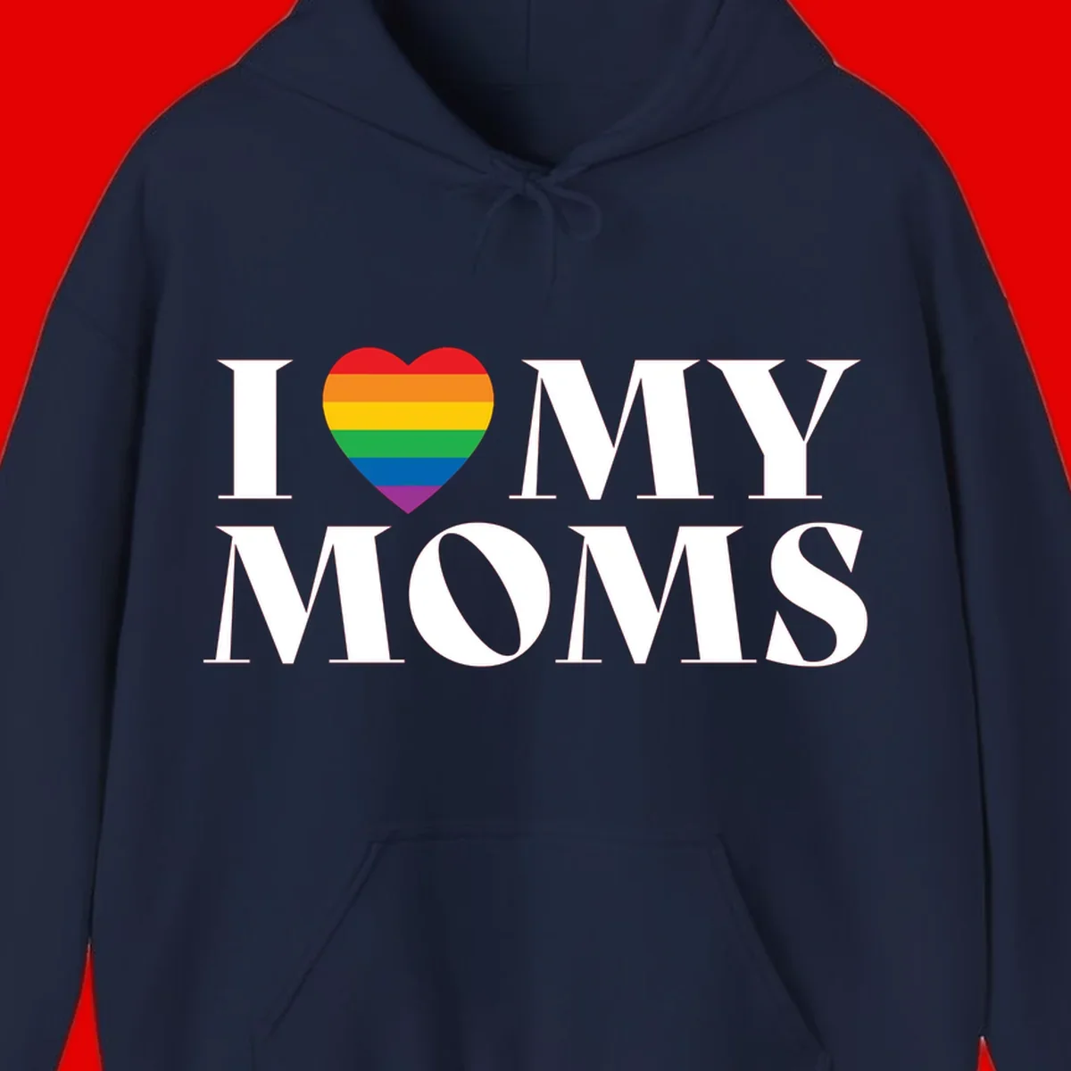 White text reading 'I love my moms' with a rainbow-striped heart symbol, celebrating LGBTQ+ family pride