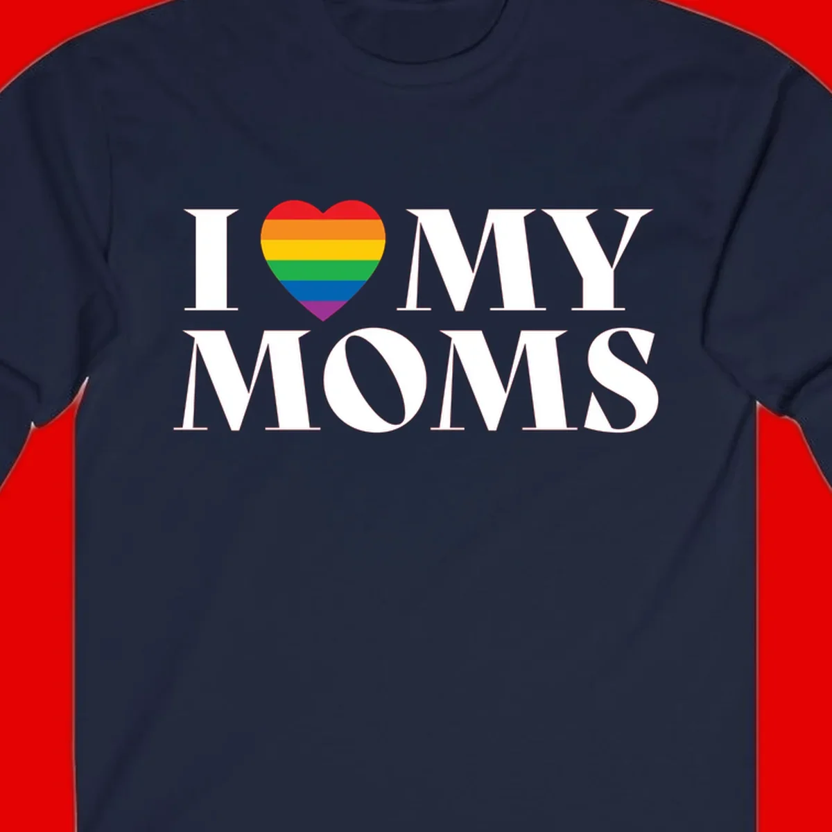 White text reading 'I love my moms' with a rainbow-striped heart symbol, celebrating LGBTQ+ family pride