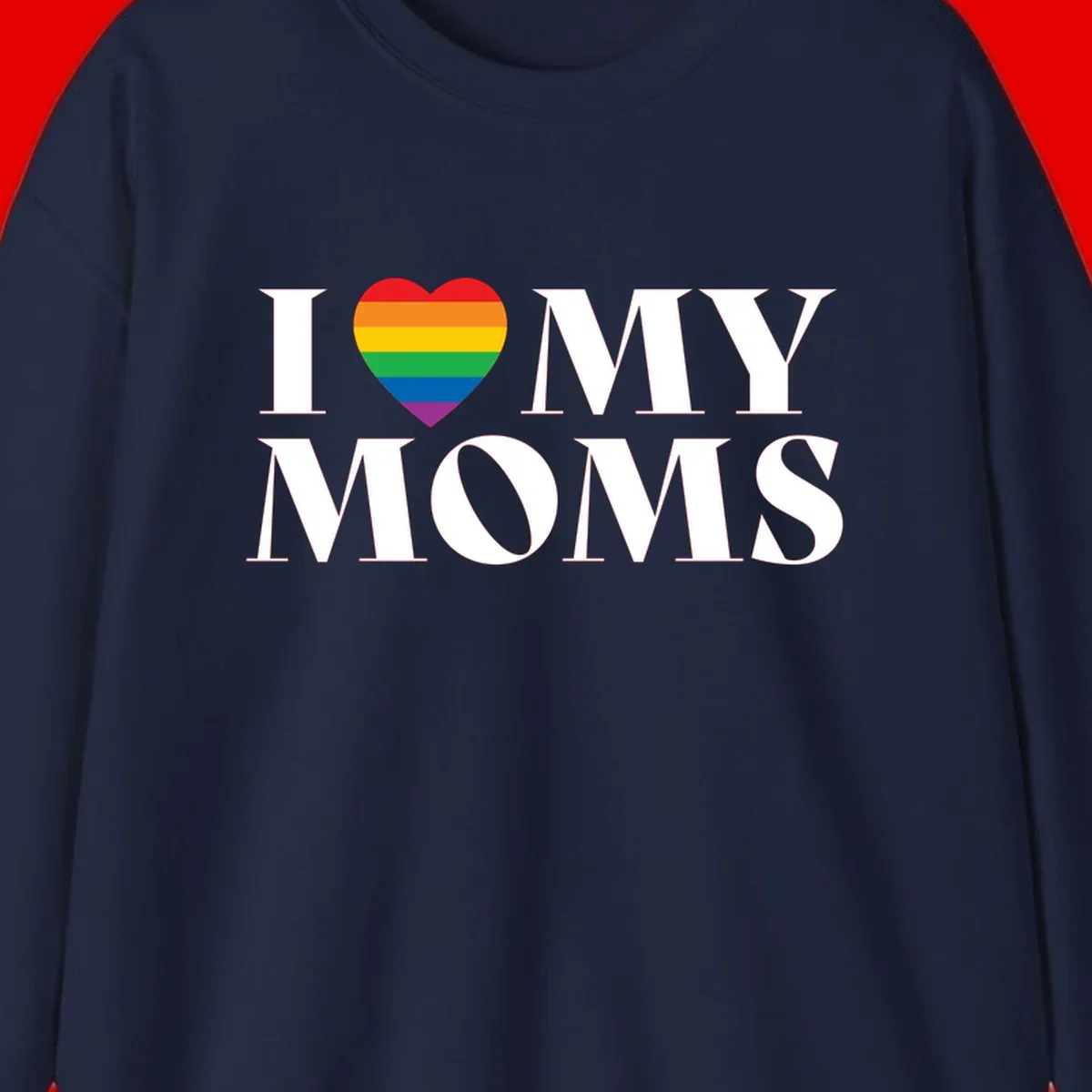 White text reading 'I love my moms' with a rainbow-striped heart symbol, celebrating LGBTQ+ family pride