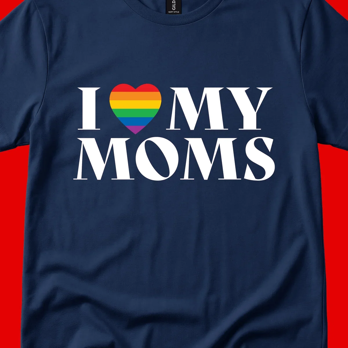 White text reading 'I love my moms' with a rainbow-striped heart symbol, celebrating LGBTQ+ family pride