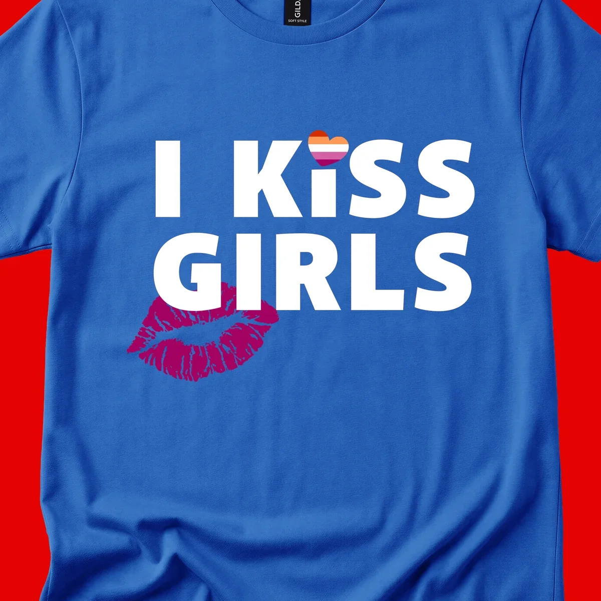 I Kiss Girls pride design with magenta lip print, rainbow heart, and bold white lettering celebrating lesbian identity