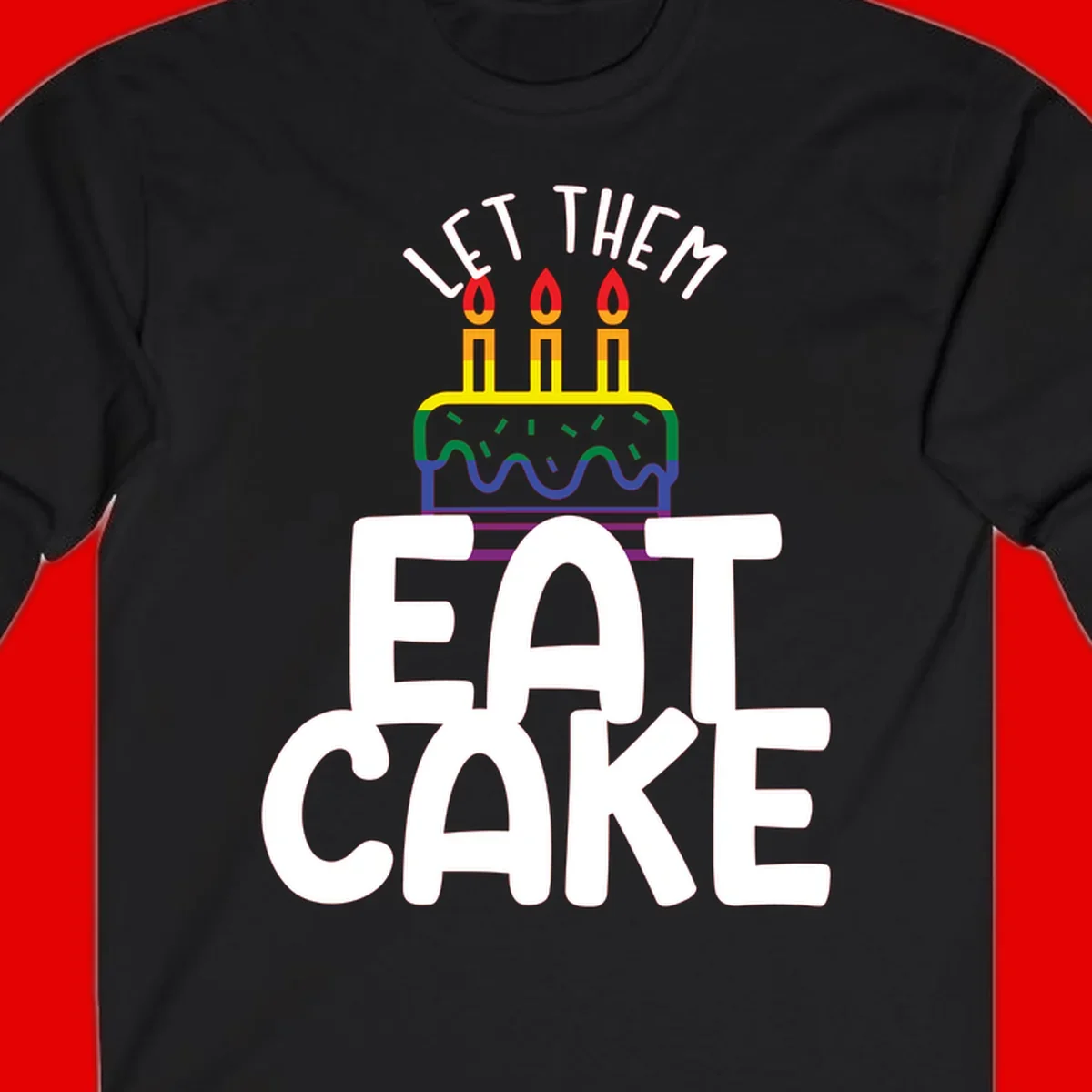 Rainbow-layered birthday cake with three candles above bold white text reading 'Let Them Eat Cake' - a Pride-themed design