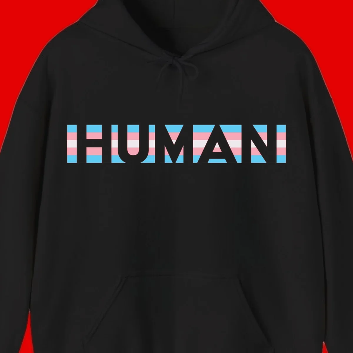 Large white letters spelling 'HUMAN' filled with horizontal blue, pink, and white stripes on gray background