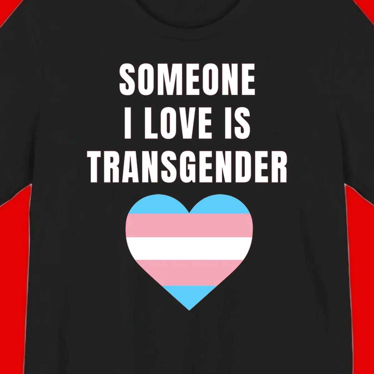 Gray background with white text reading 'Someone I Love Is Transgender' above a heart featuring blue, pink, and white transgender flag stripes
