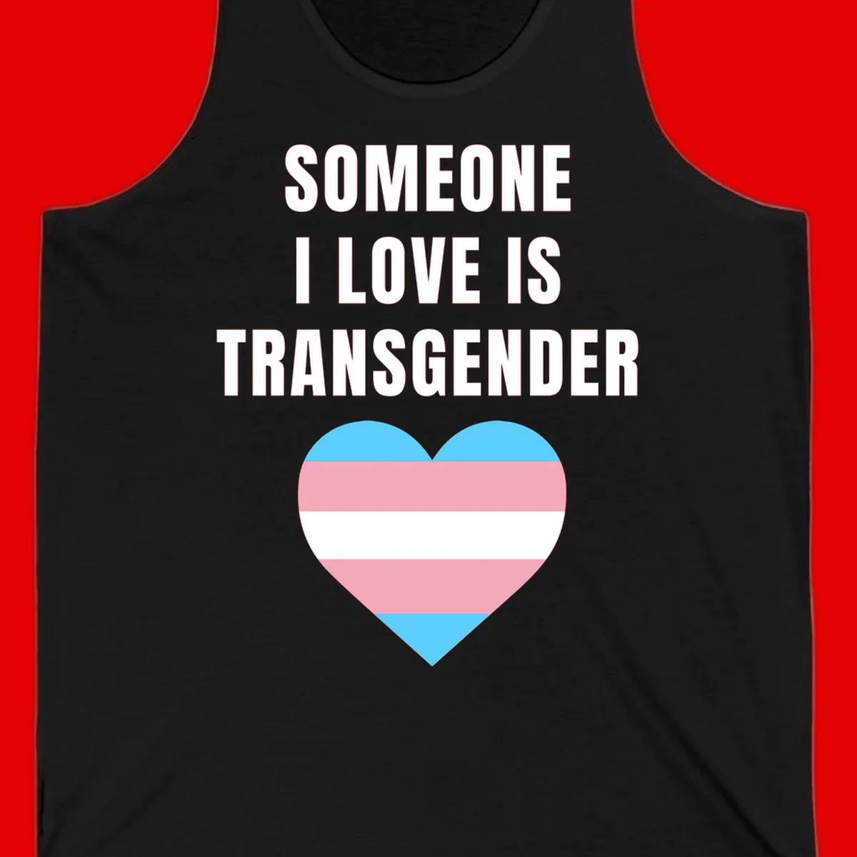 Gray background with white text reading 'Someone I Love Is Transgender' above a heart featuring blue, pink, and white transgender flag stripes