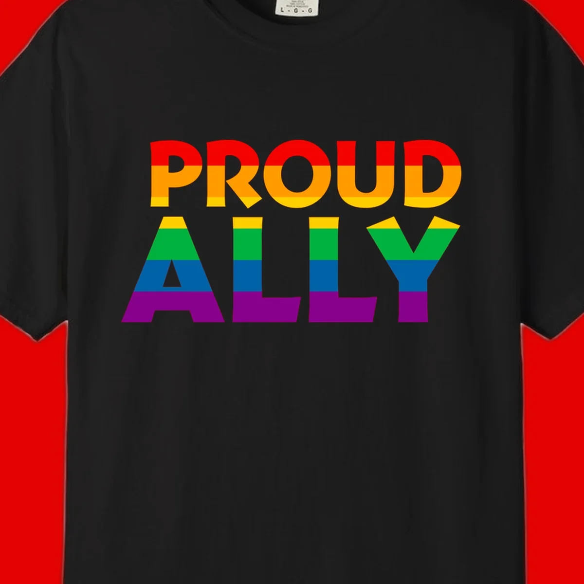 Proud Ally design with rainbow-striped letters in pride flag colors on gray background