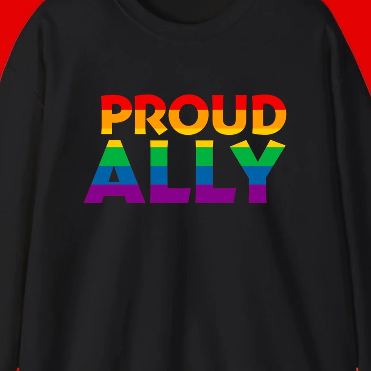 Proud Ally design with rainbow-striped letters in pride flag colors on gray background