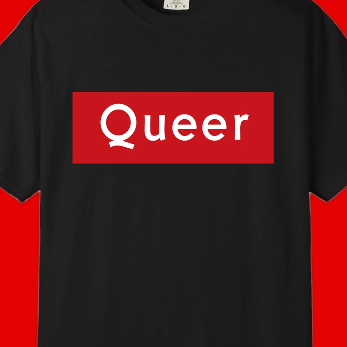 Bold white 'Queer' text on bright red background - a powerful queer pride statement design