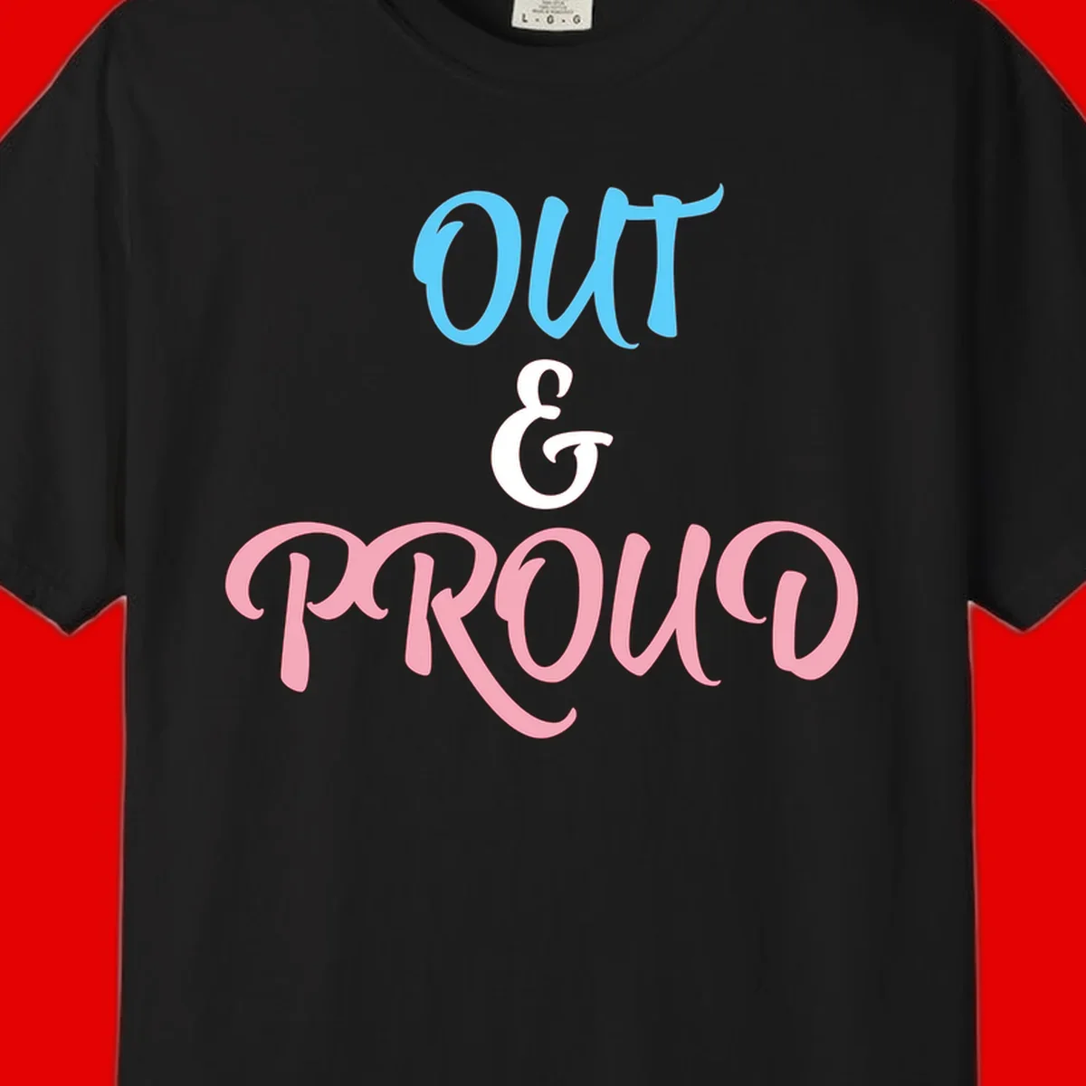 Out and proud pride design with blue 'OUT' text, white ampersand, and pink 'PROUD' lettering on gray background