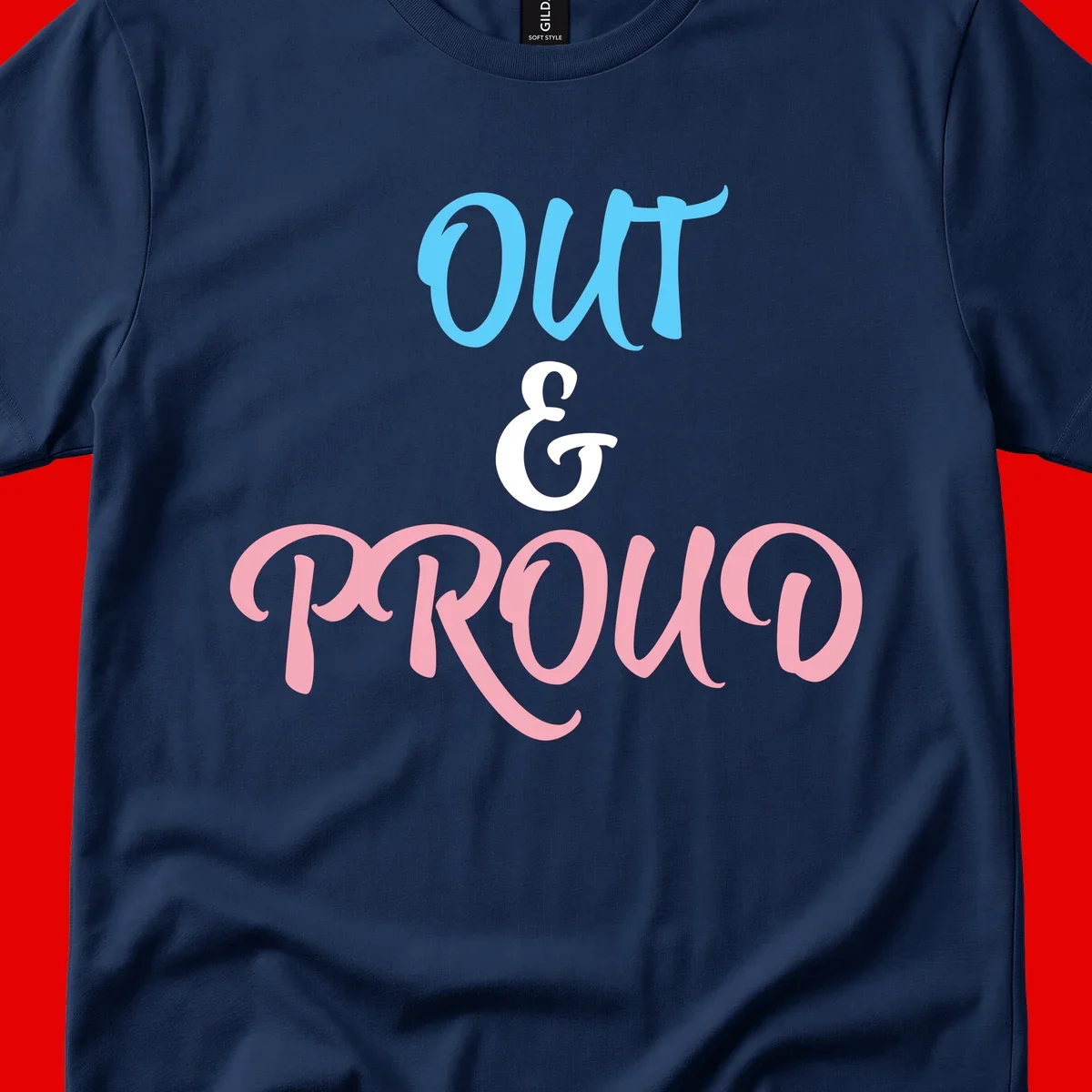 Out and proud pride design with blue 'OUT' text, white ampersand, and pink 'PROUD' lettering on gray background