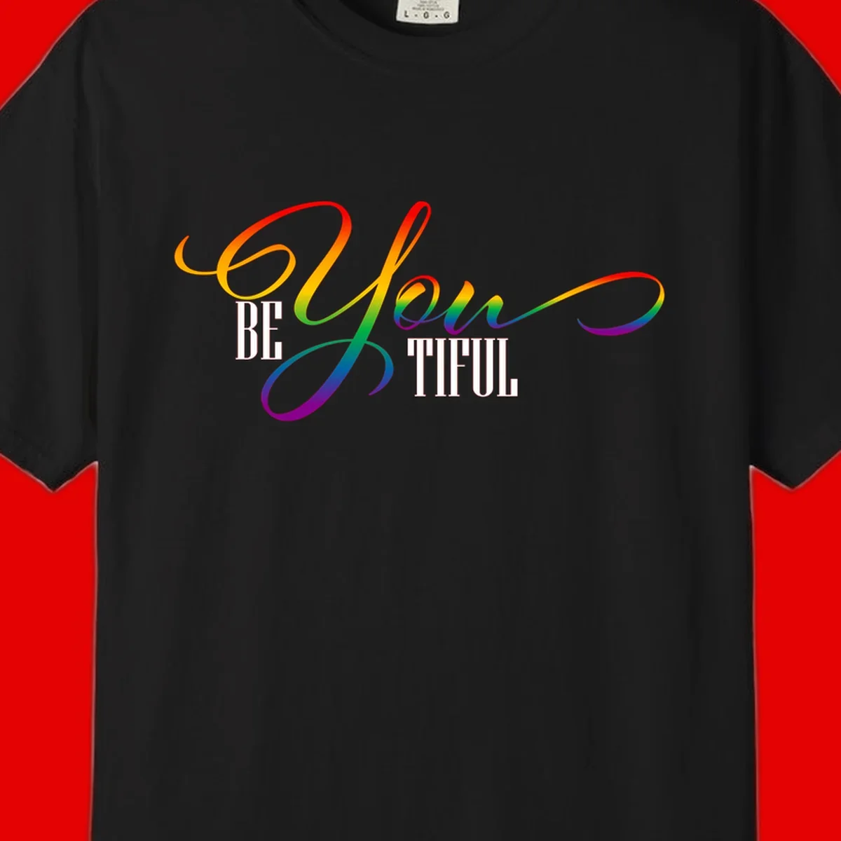 Colorful be-you-them-pride design with flowing rainbow gradient text transitioning from red to purple on gray background