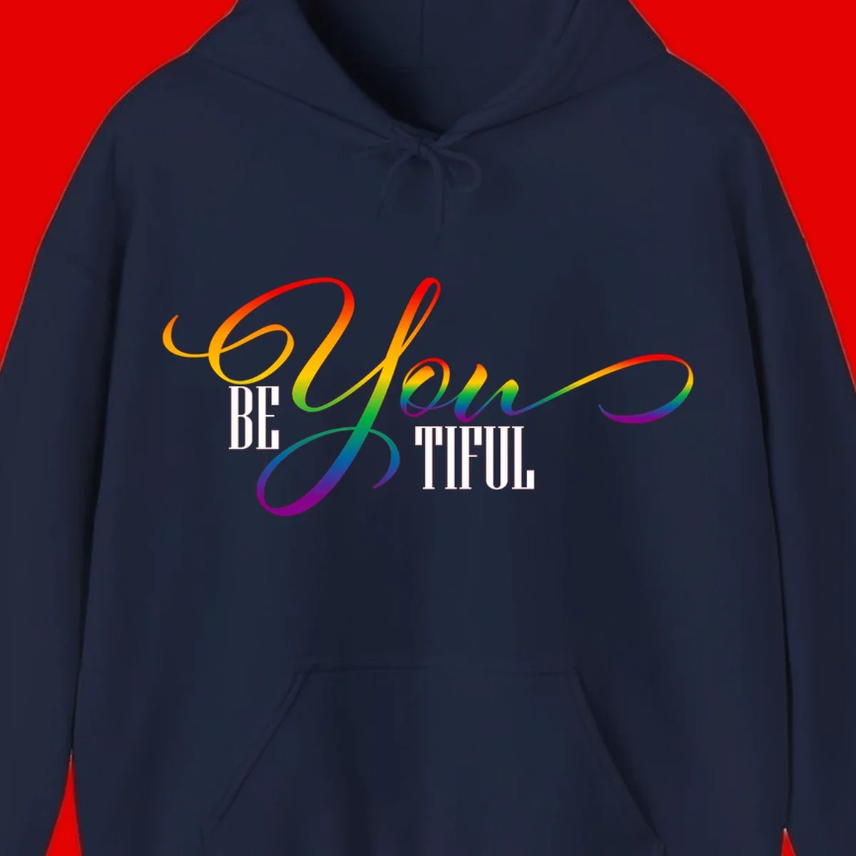 Colorful be-you-them-pride design with flowing rainbow gradient text transitioning from red to purple on gray background