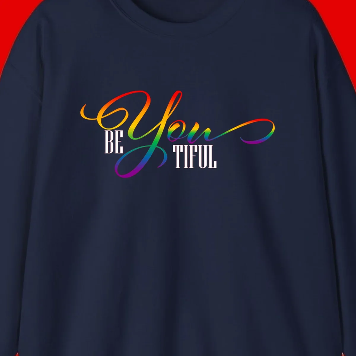 Colorful be-you-them-pride design with flowing rainbow gradient text transitioning from red to purple on gray background