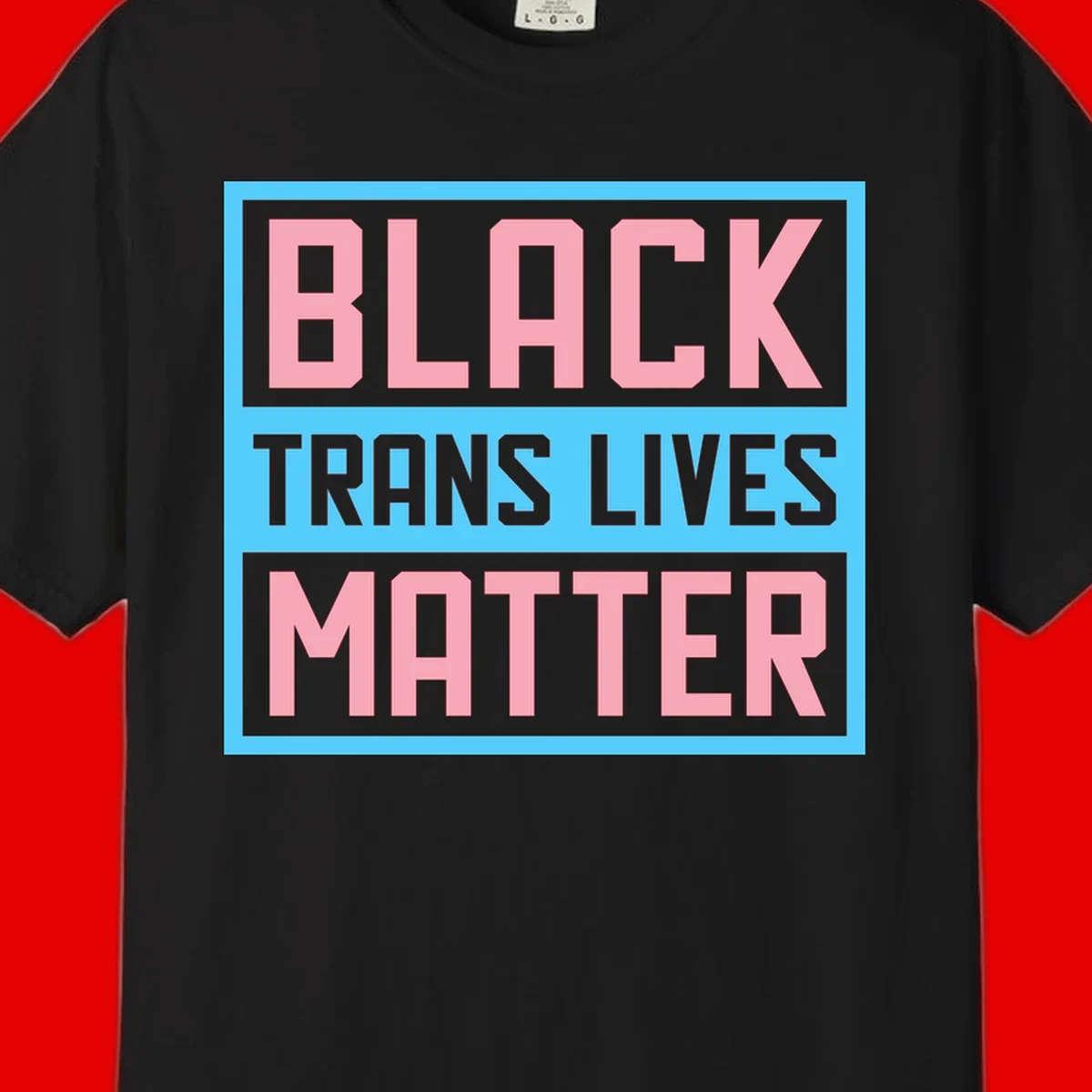Bold pink block letters spelling 'BLACK TRANS LIVES MATTER' on light blue and gray background