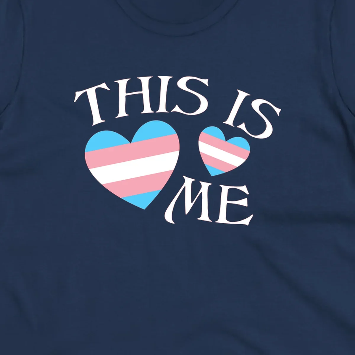 Two striped hearts in trans flag colors (blue, pink, white) with 'THIS IS ME' text celebrating trans pride and identity