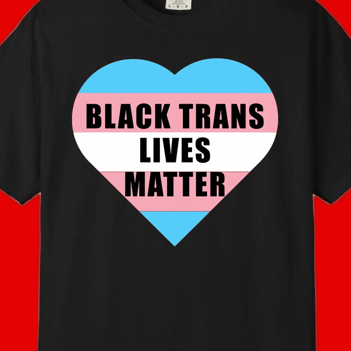 Heart-shaped design with trans flag stripes (blue, pink, white) and bold text reading 'BLACK TRANS LIVES MATTER'