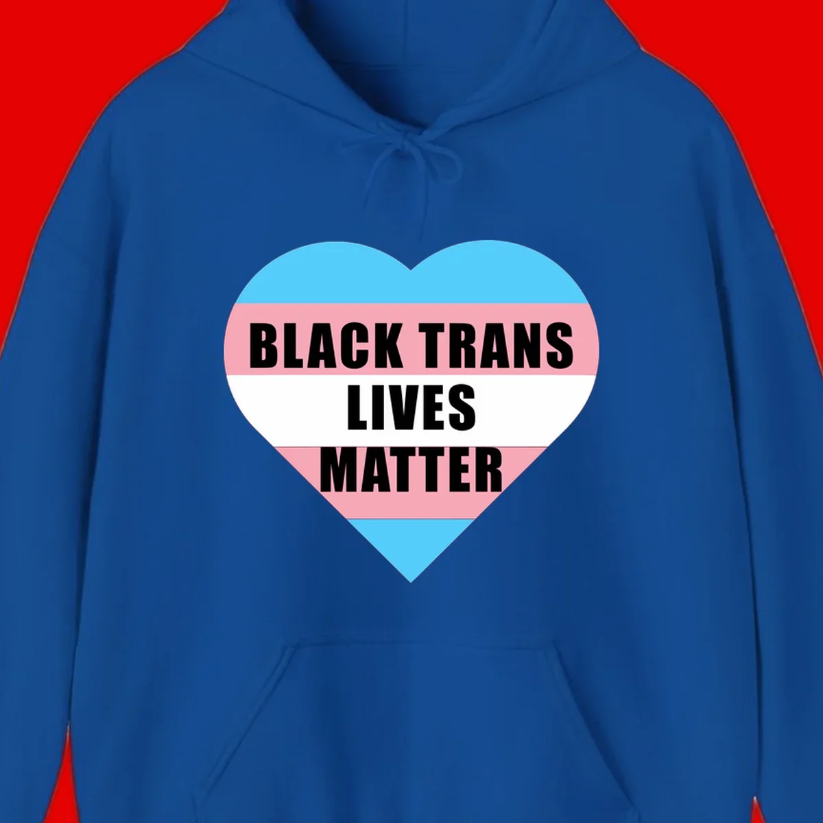 Heart-shaped design with trans flag stripes (blue, pink, white) and bold text reading 'BLACK TRANS LIVES MATTER'