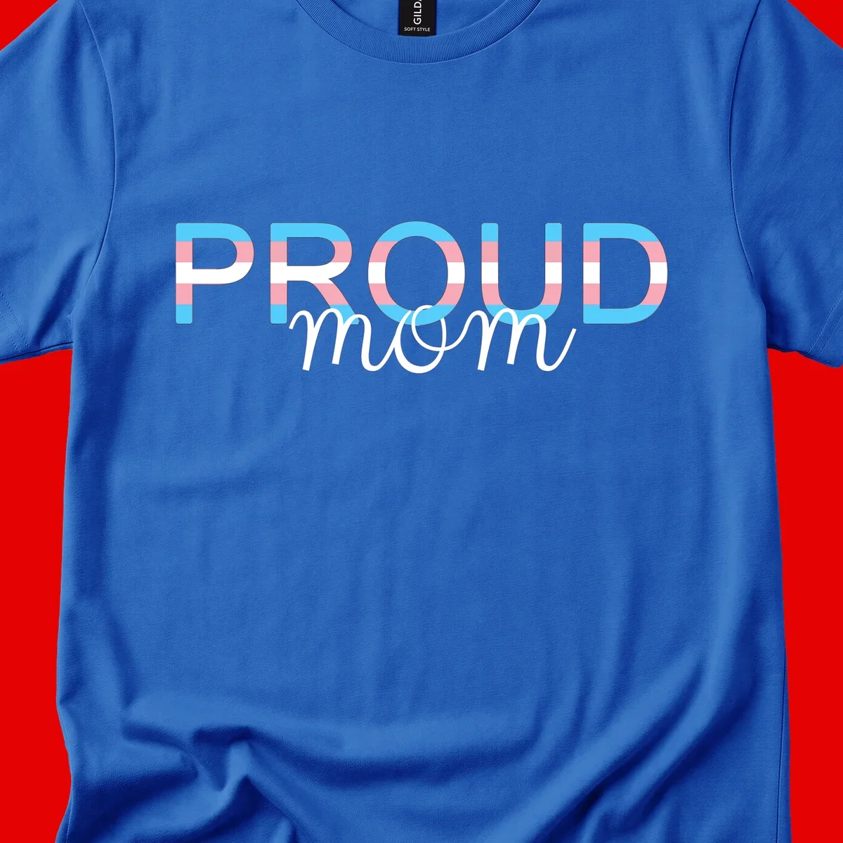 Proud mom pride design with bold striped rainbow letters in cyan, pink, and white on gray background