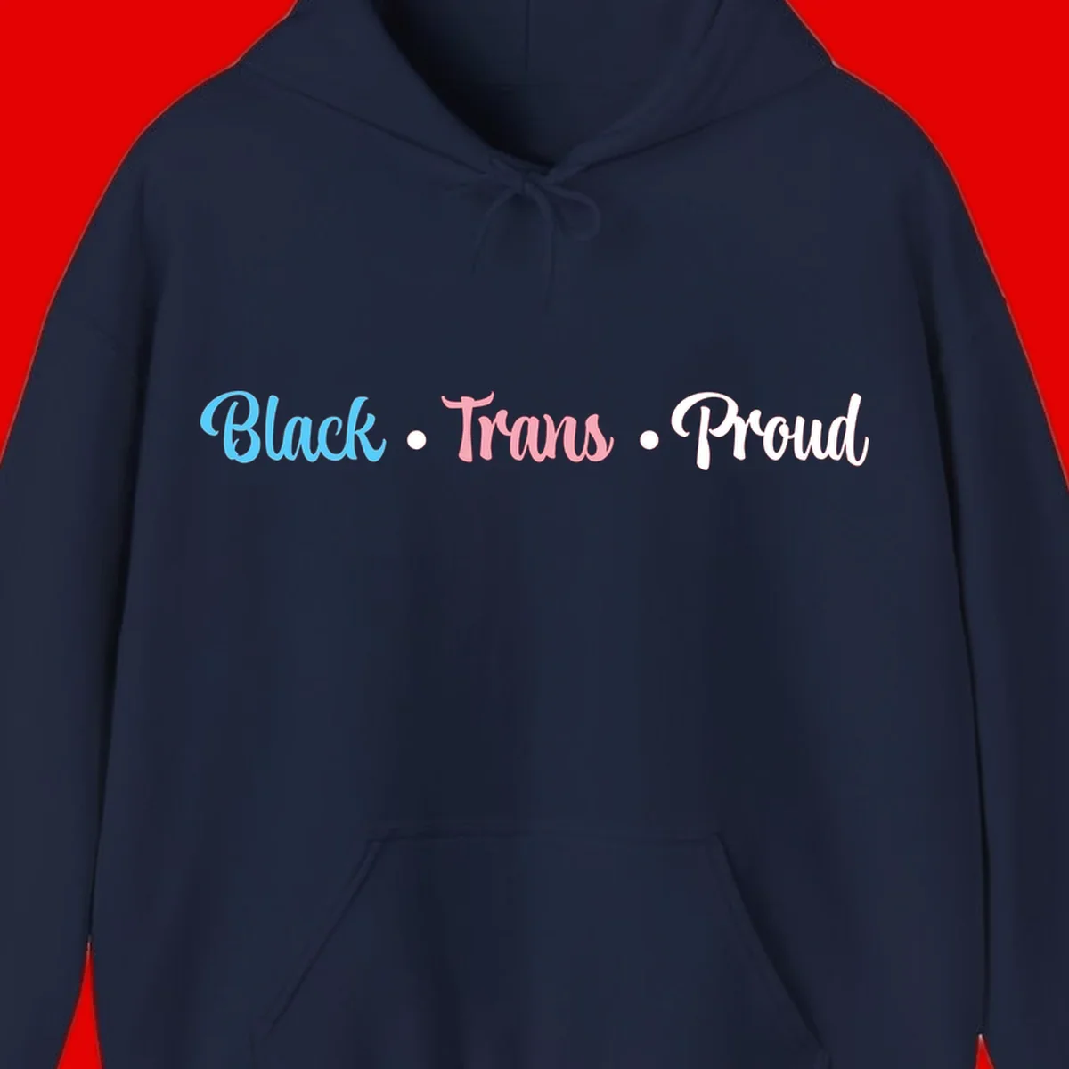 Black Trans Proud design with blue, pink, and white text on gray background, featuring decorative dots