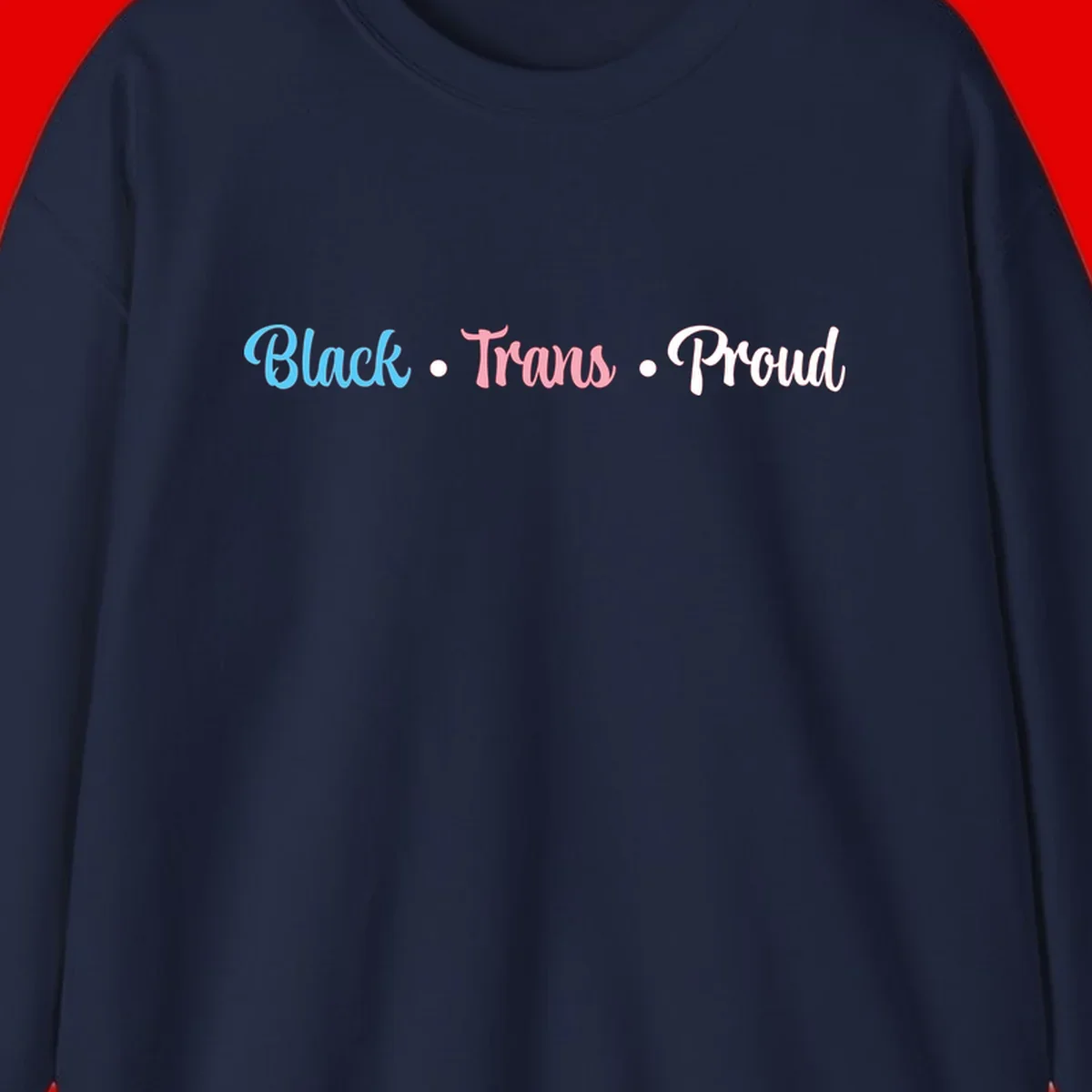 Black Trans Proud design with blue, pink, and white text on gray background, featuring decorative dots