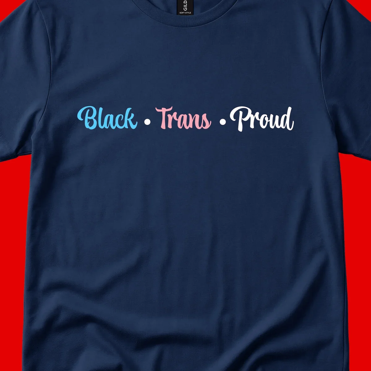 Black Trans Proud design with blue, pink, and white text on gray background, featuring decorative dots