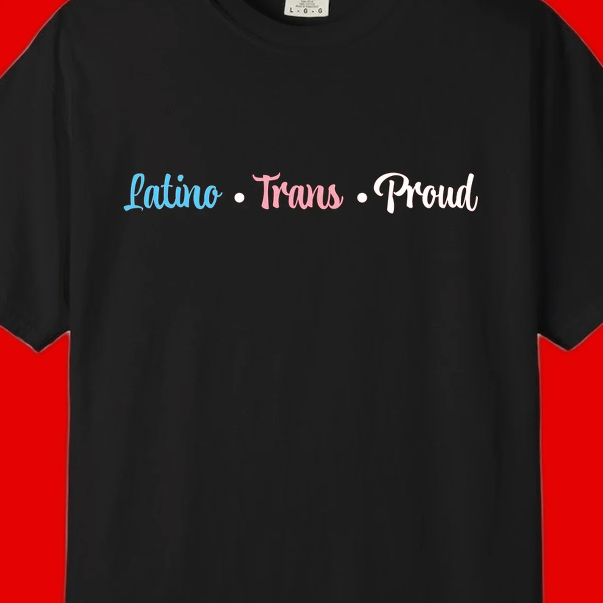 Latino Trans Proud design with blue, pink, and white script text on gray background celebrating LGBTQ identity