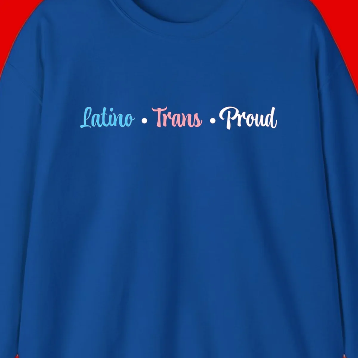 Latino Trans Proud design with blue, pink, and white script text on gray background celebrating LGBTQ identity