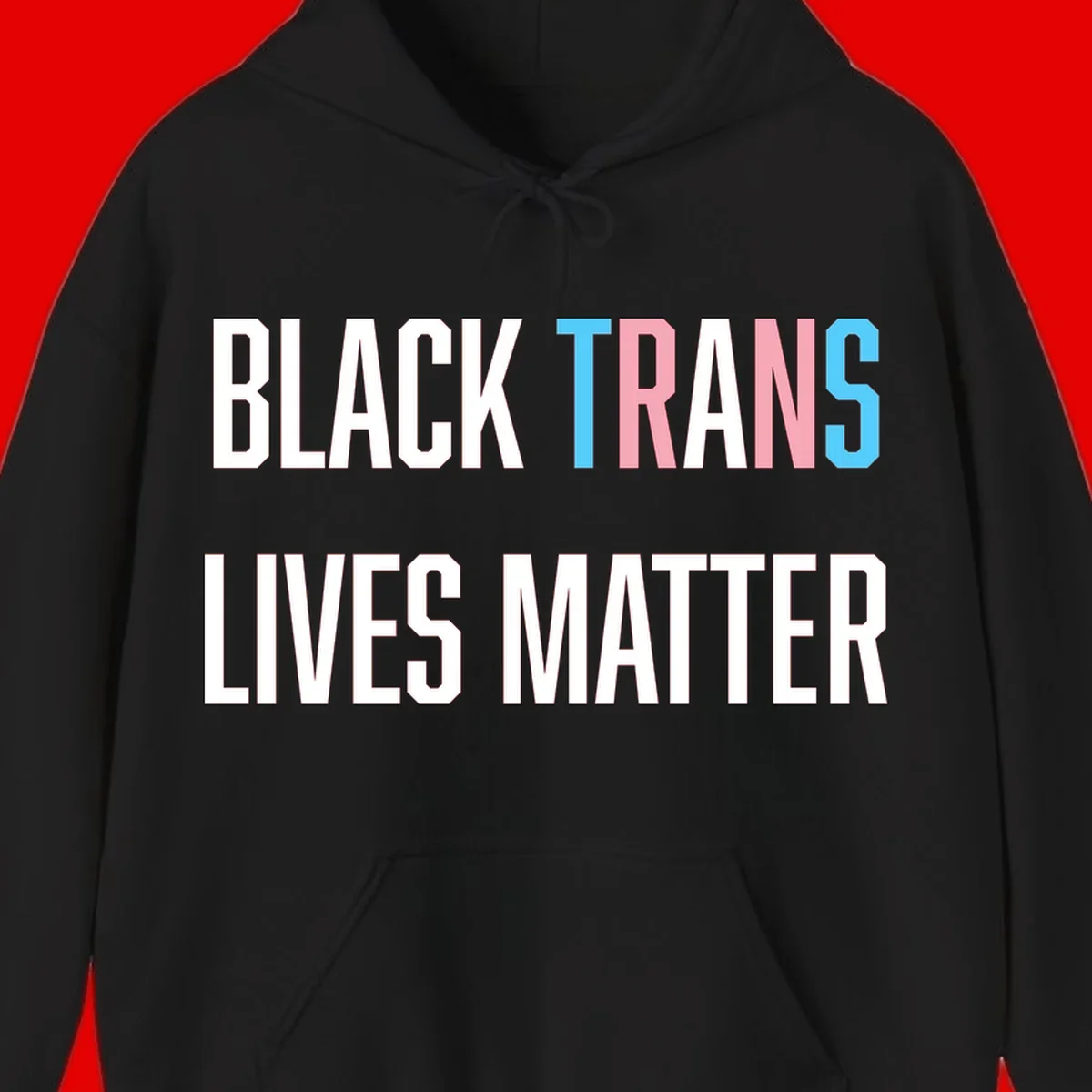Bold typography design reading 'BLACK TRANS LIVES MATTER' with 'TRANS' in pink and cyan pride colors on gray background