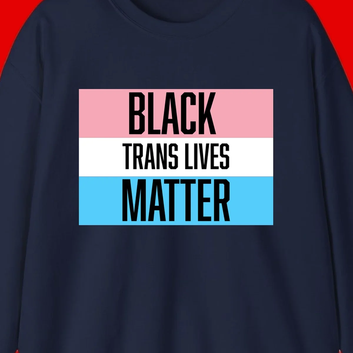 Black Trans Lives Matter design with bold text on trans pride flag colored horizontal stripes: pink, white, and blue