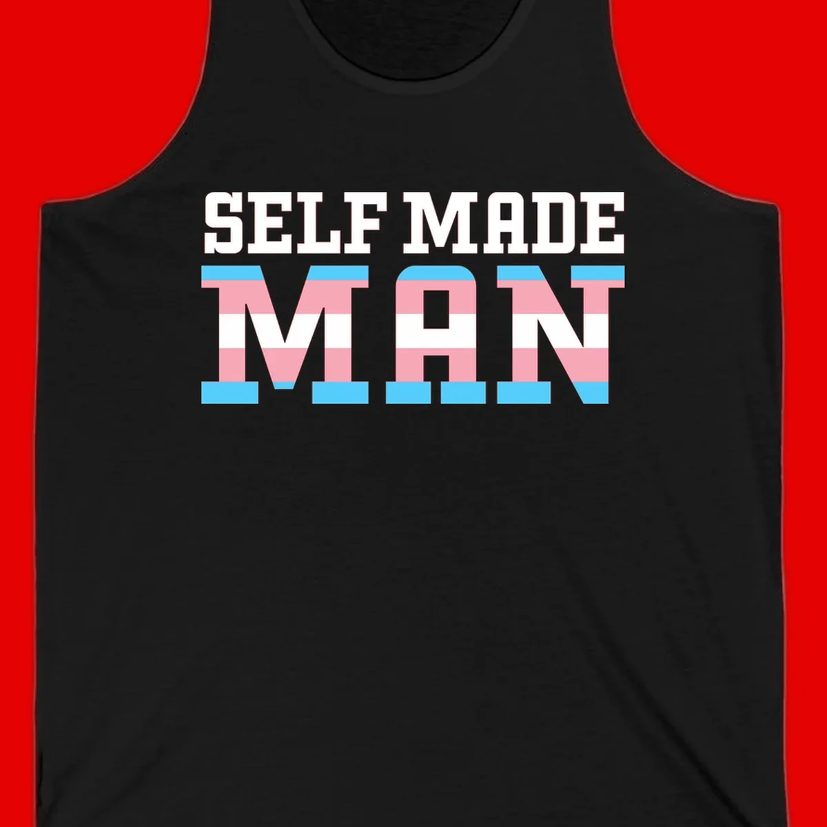 Bold 'Self Made' text filled with transgender pride flag stripes in blue, pink, and white on gray background