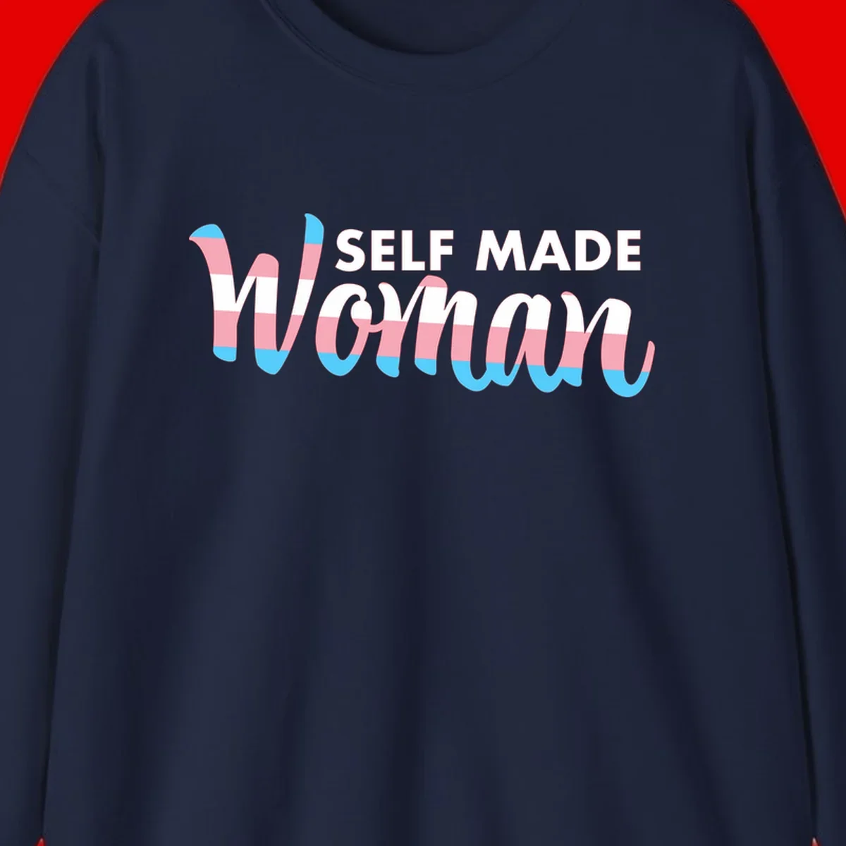 Self Made Woman design featuring bold wavy striped lettering in pink, white, and blue trans flag colors